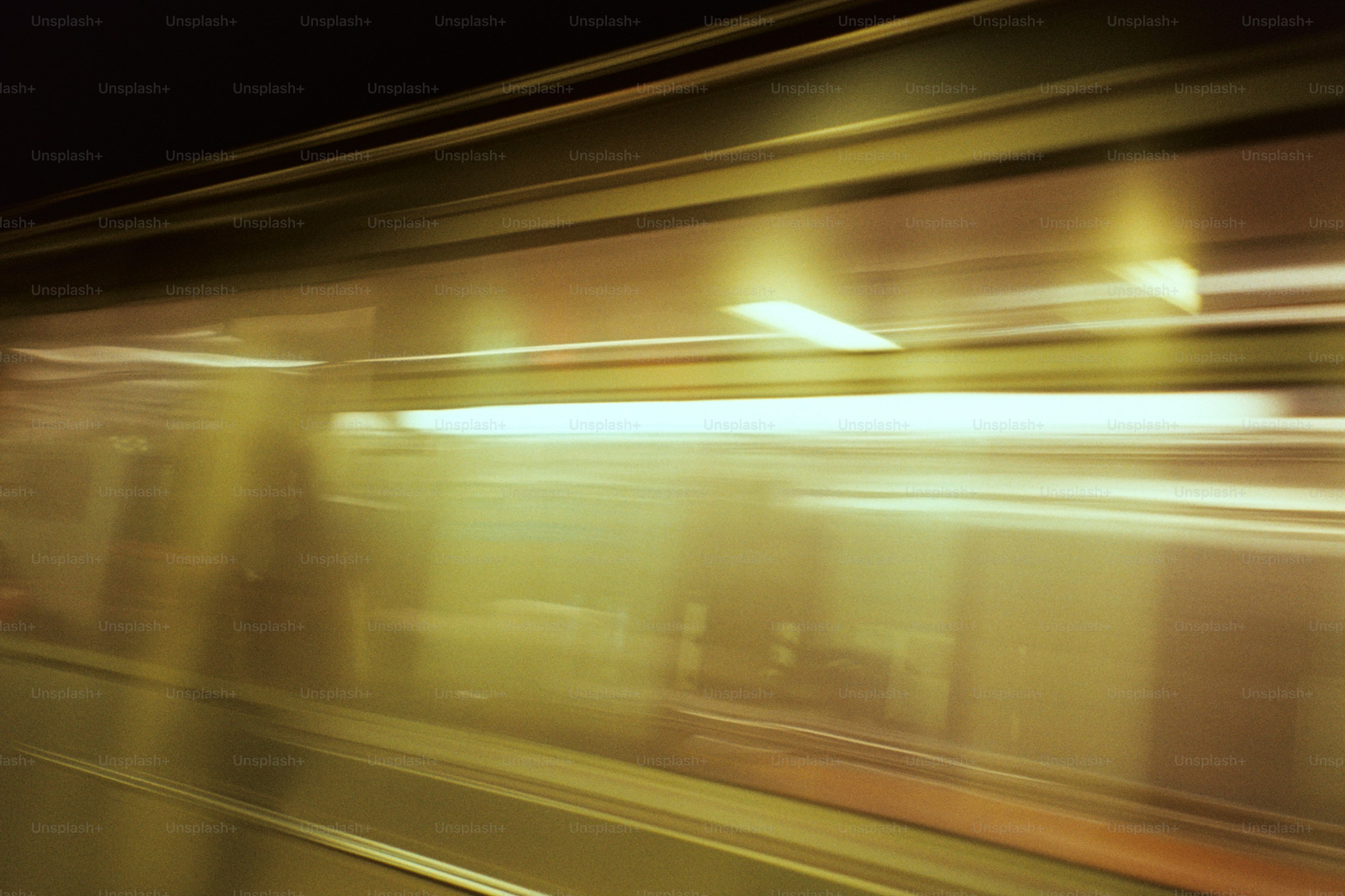 Blurred lights in a moving subway tunnel