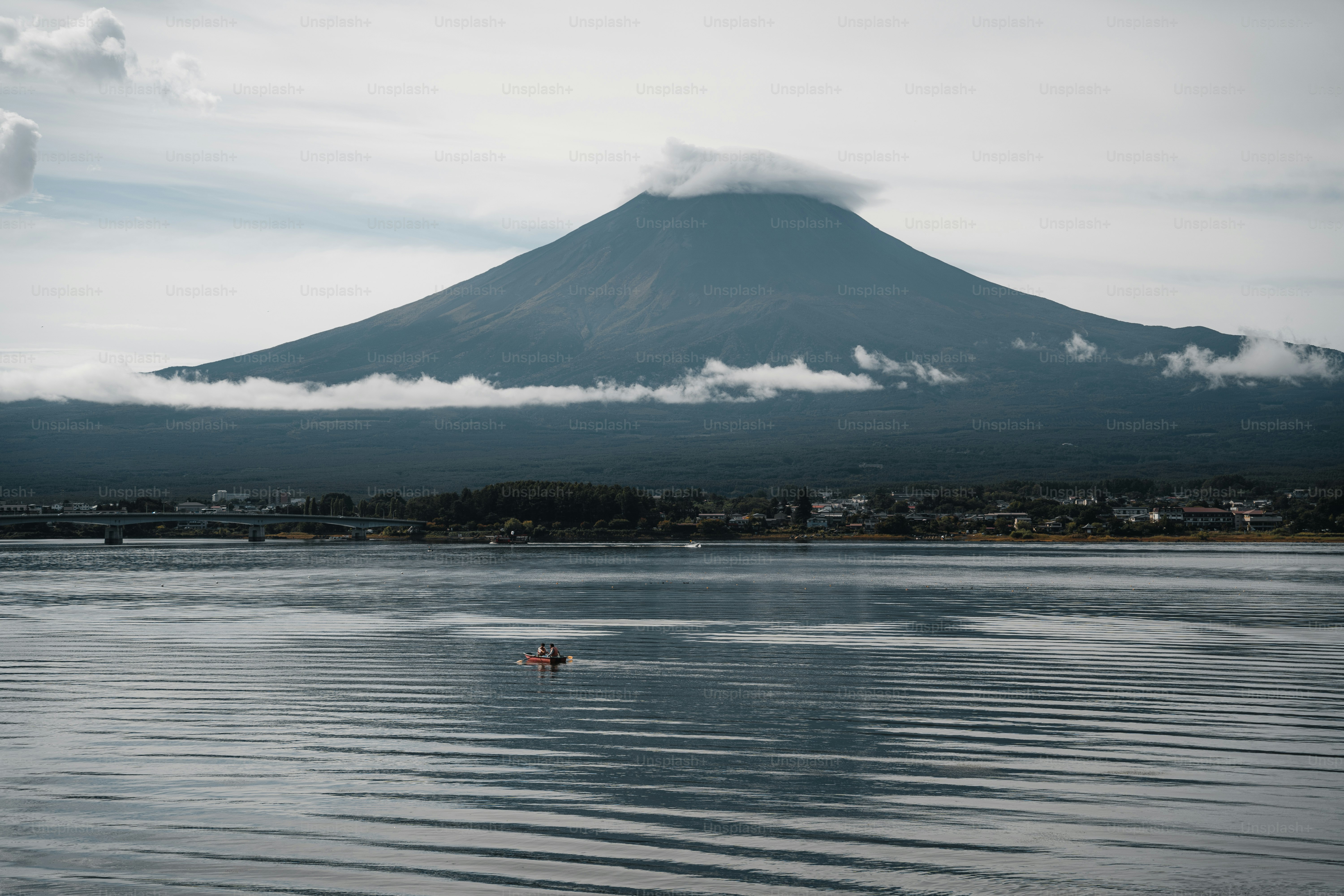 Mount fuji with clouds over a calm lake