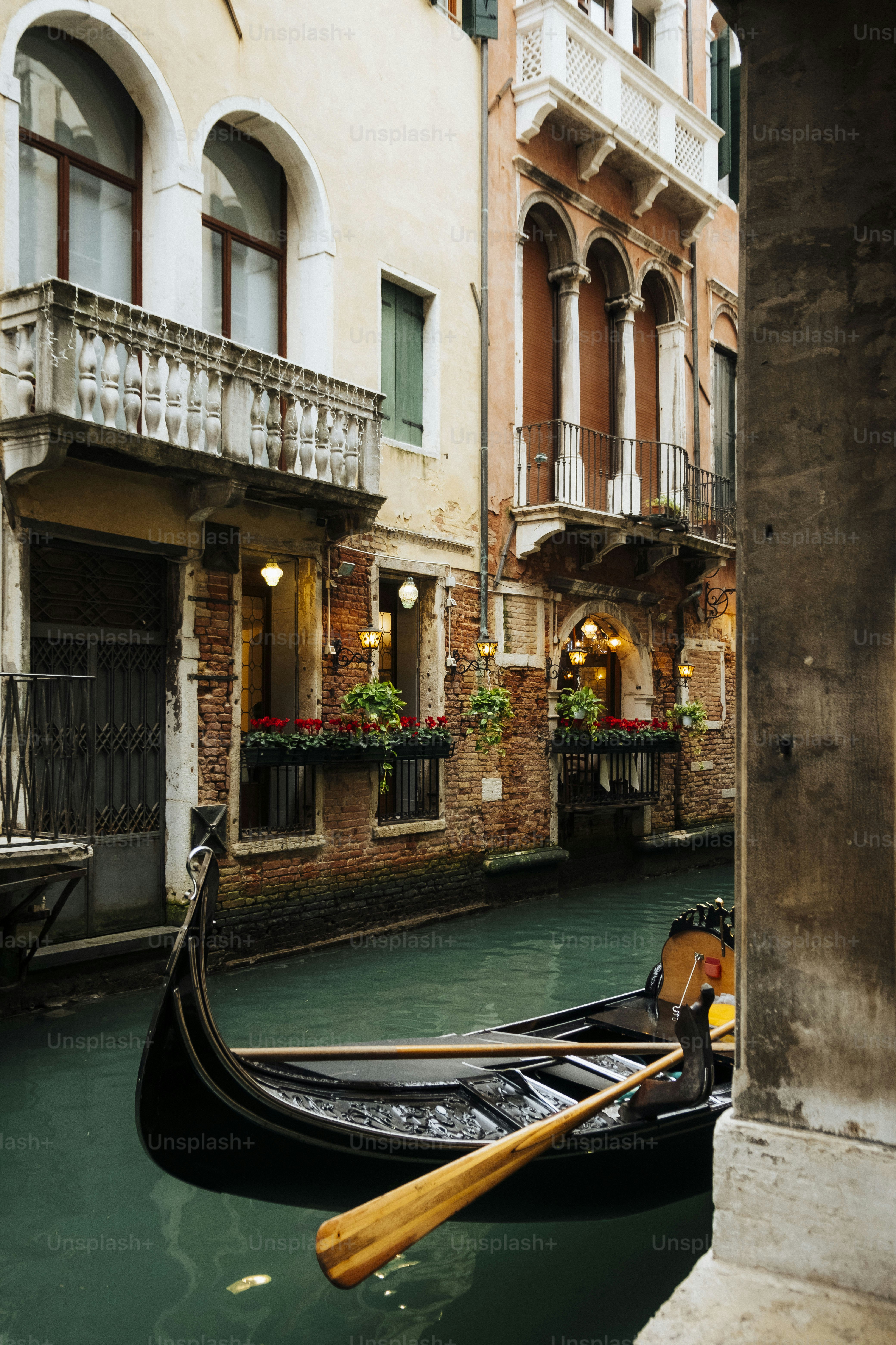 A gondola floats on a canal in venice.