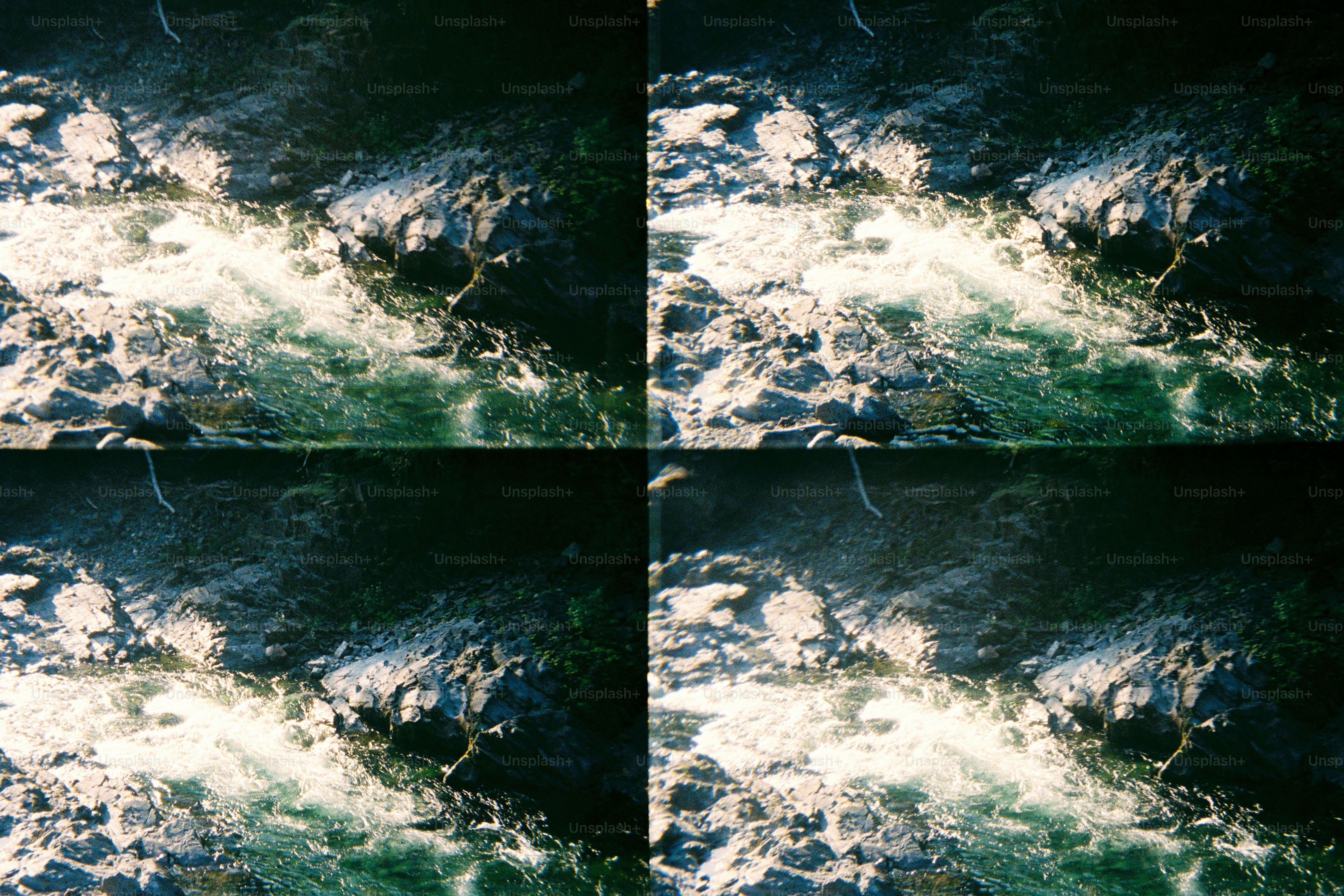 El agua corriente cae sobre las rocas en primer plano