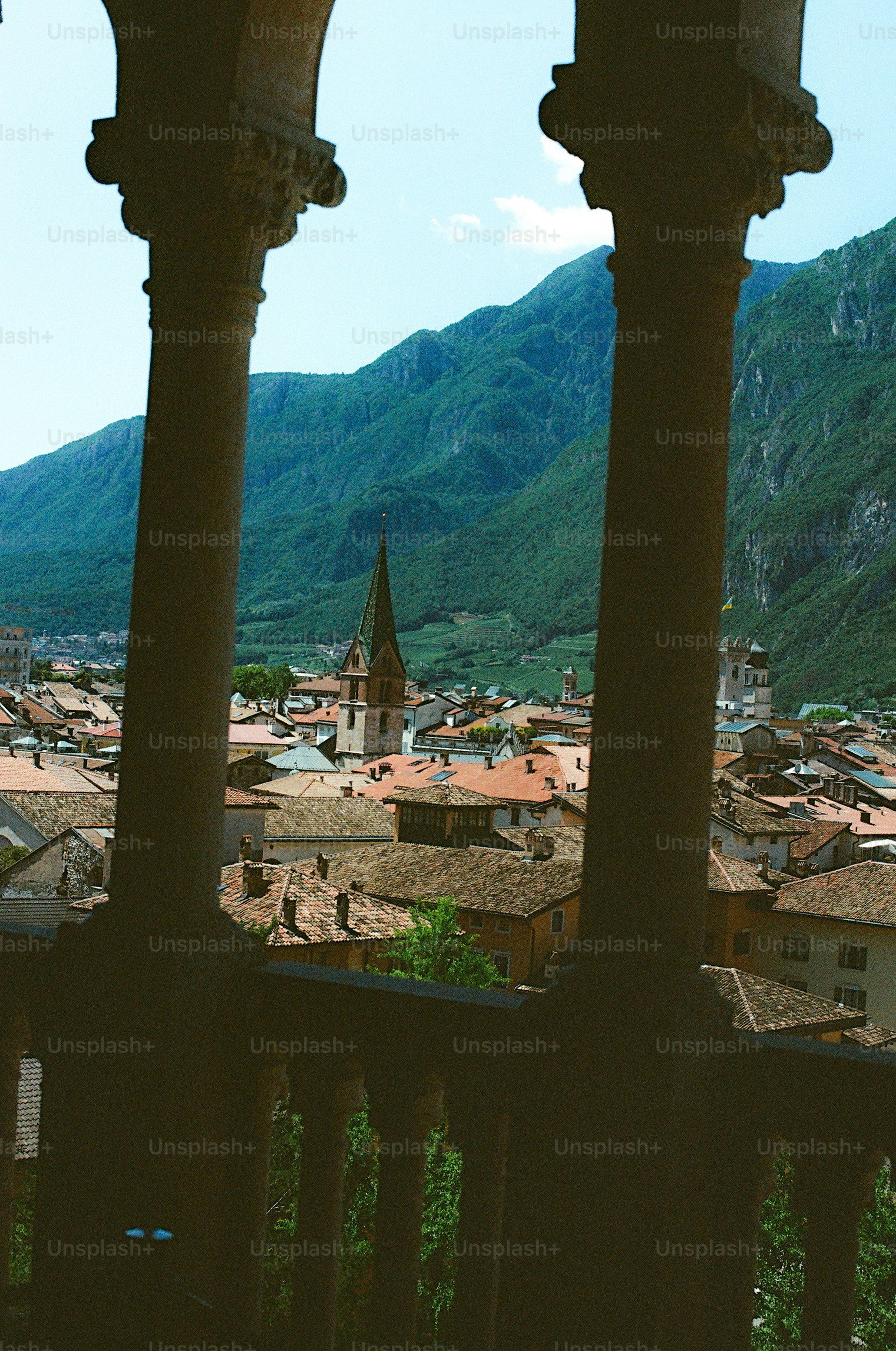 View of a european town with mountains behind.