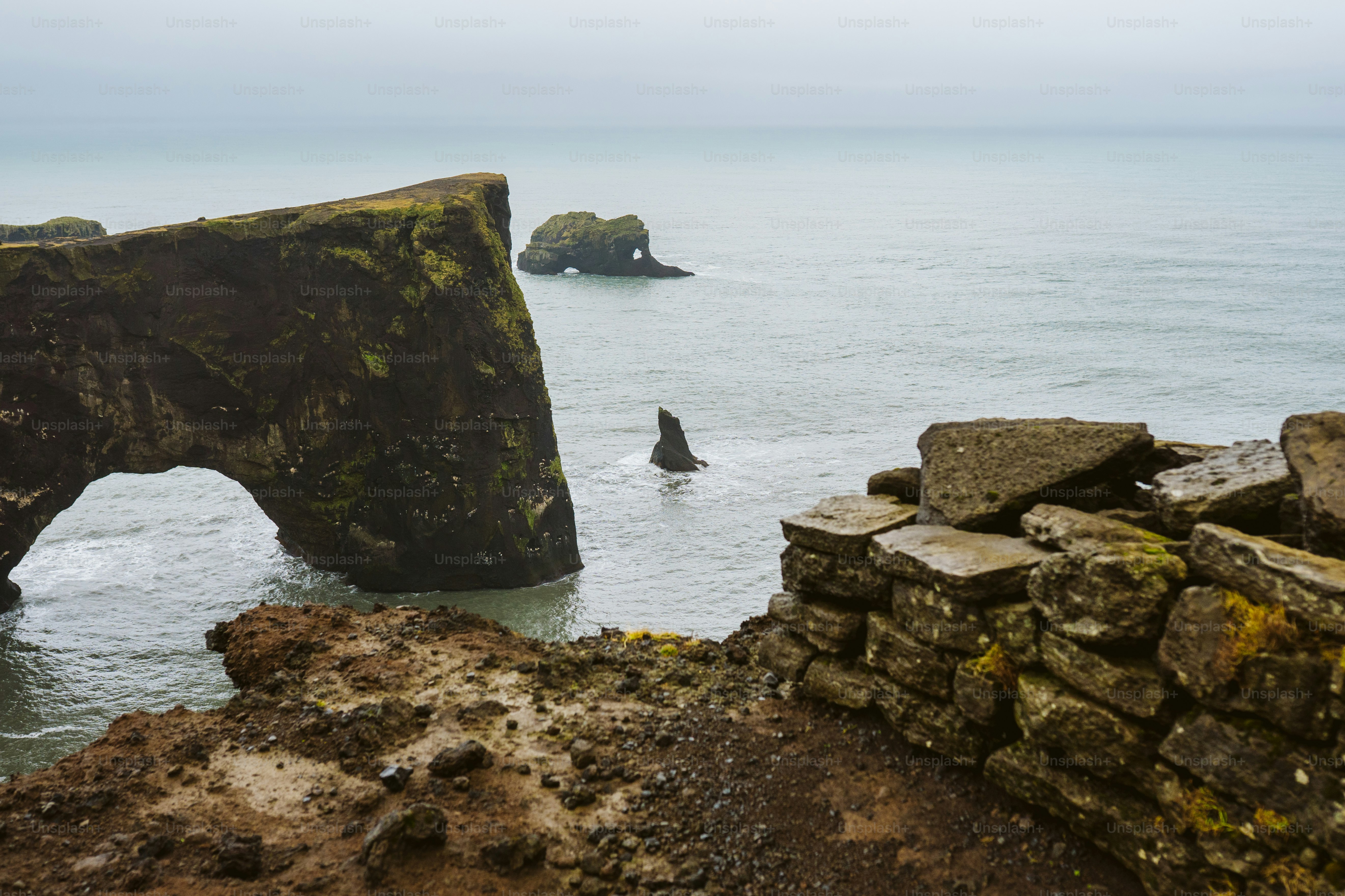 Rocky coastline with sea stacks and arch