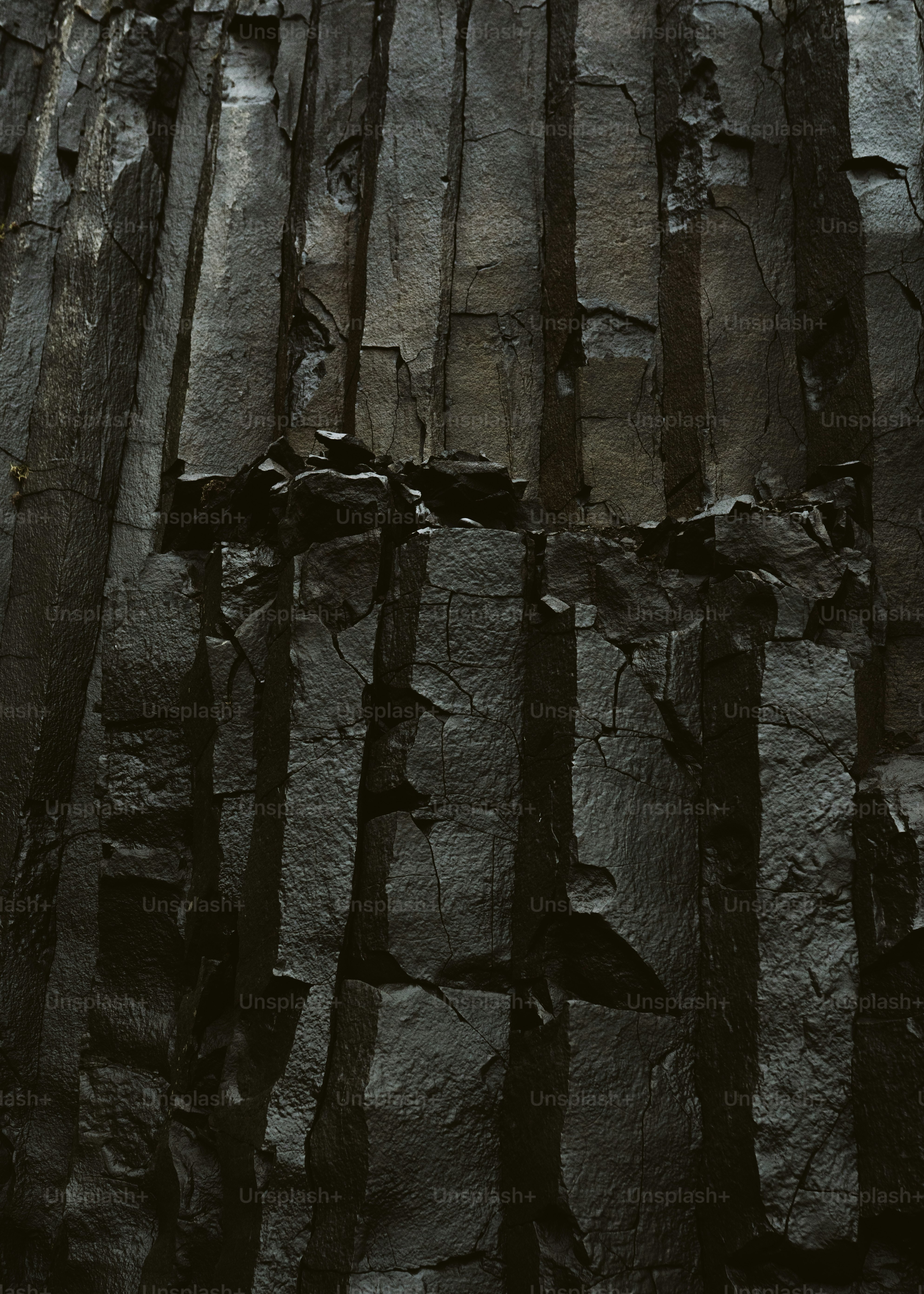 Dark basalt columns forming a natural wall