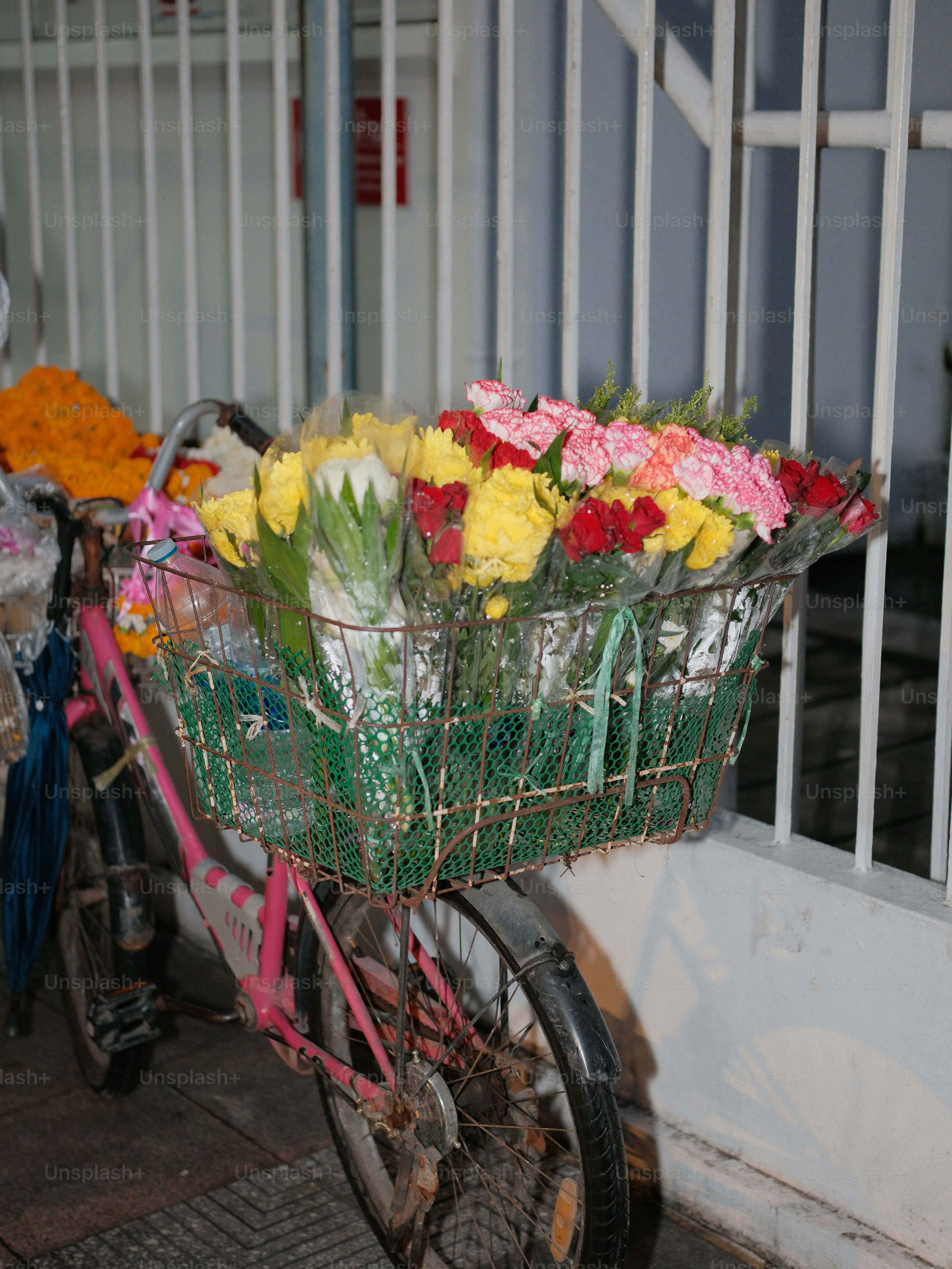 Bicycle basket filled with colorful flowers