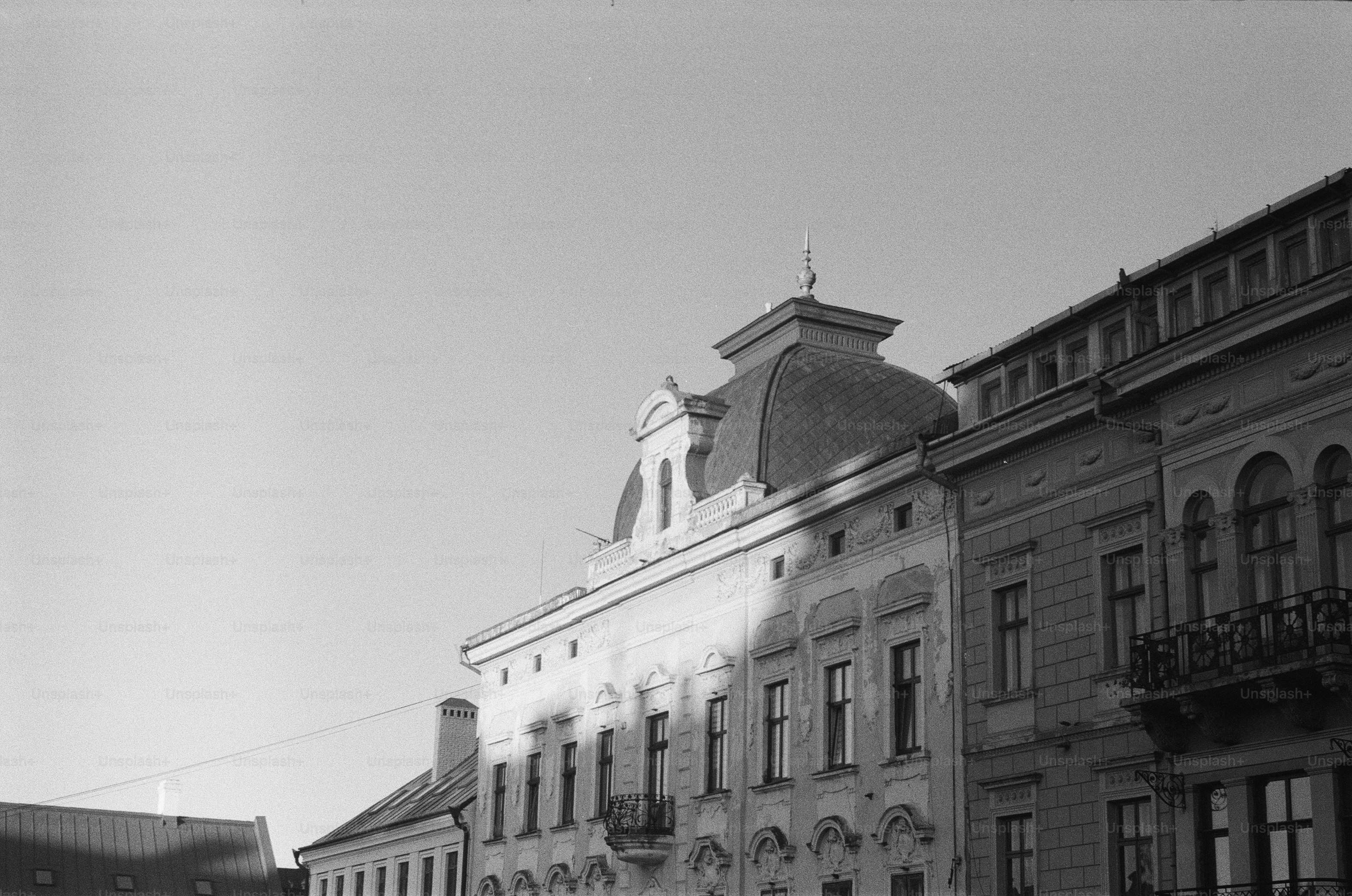 Ornate historic buildings under a bright sky.