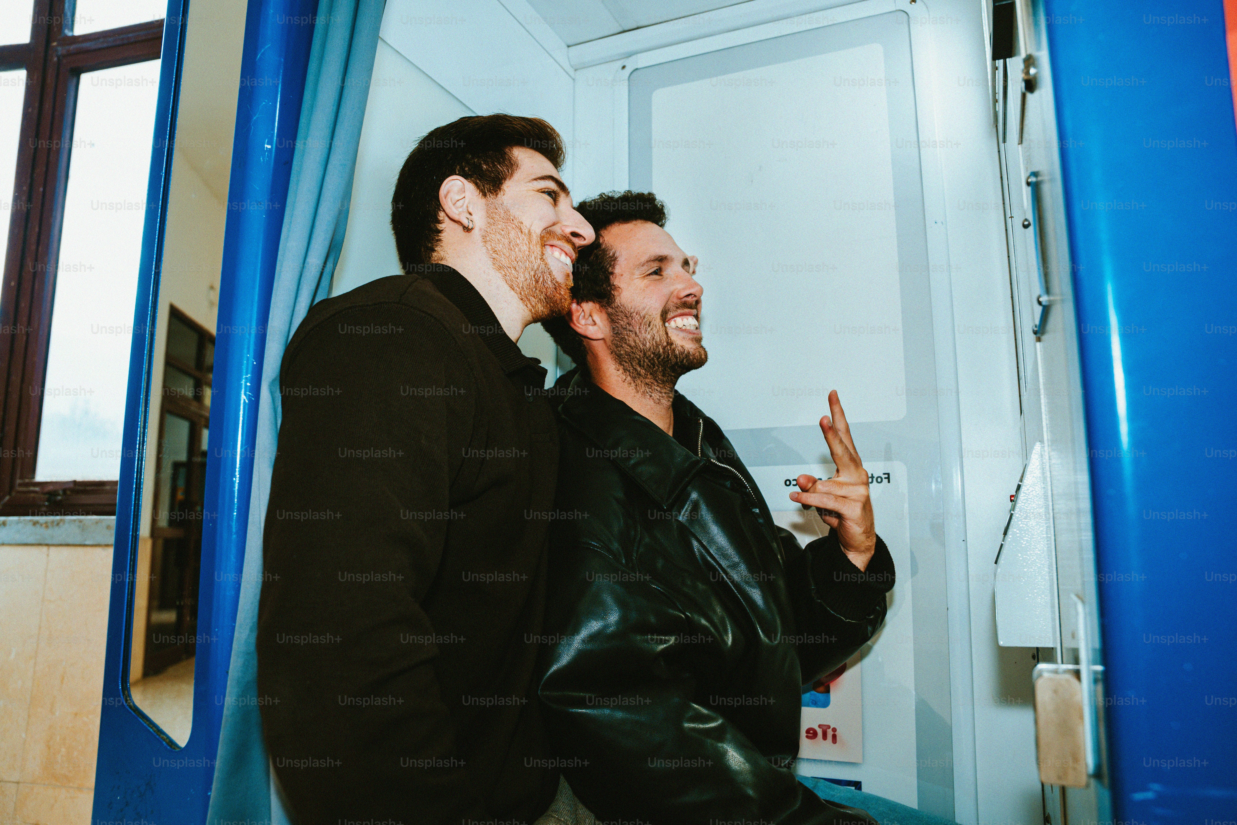 Two men smiling and looking at each other photo – Outdoor Image on Unsplash