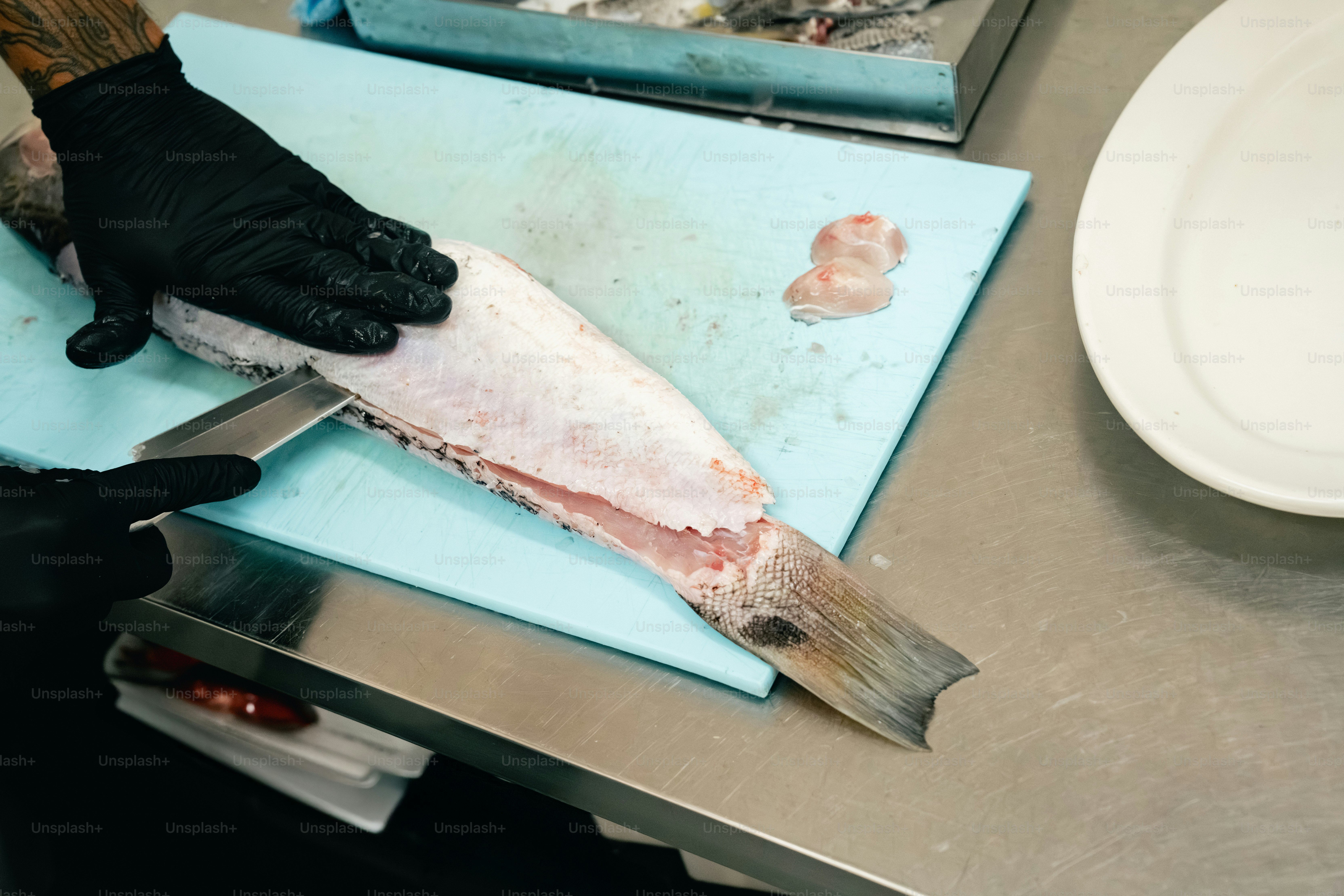 Chef prepares fish on a cutting board photo – Food Image on Unsplash
