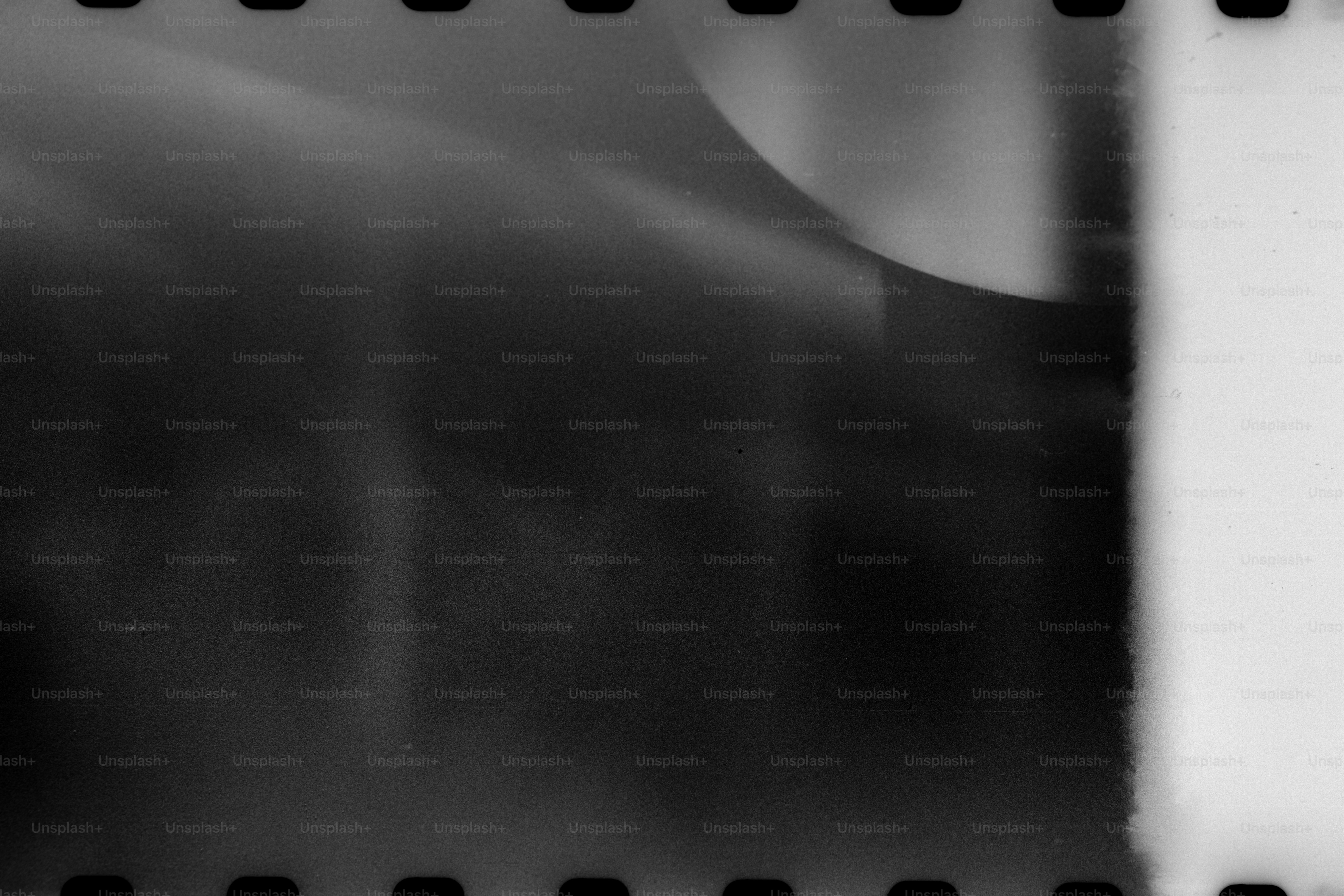 Abstract black and white film texture with perforations