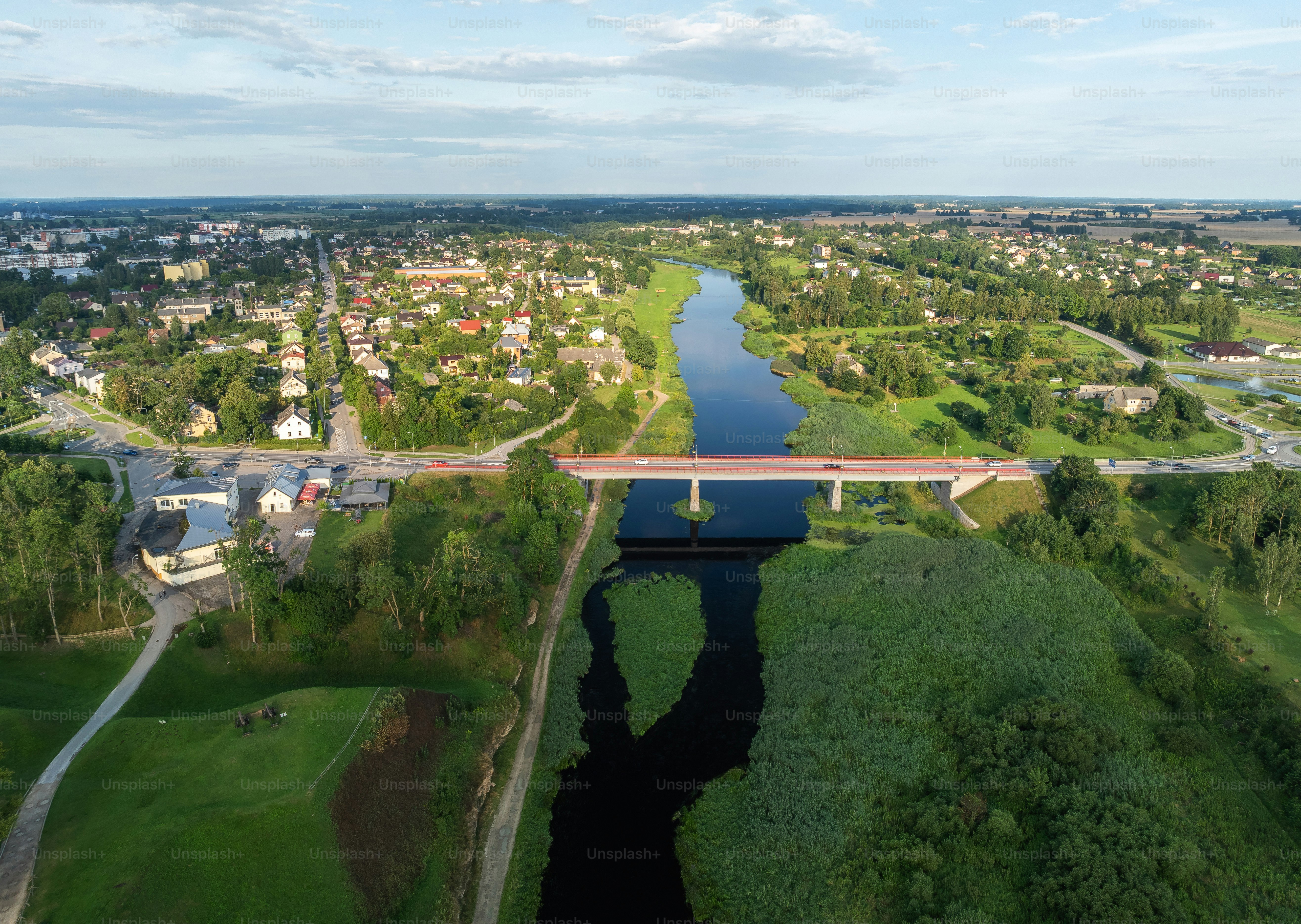 Aerial view of a town with a river and bridge photo – Scenery Image on ...