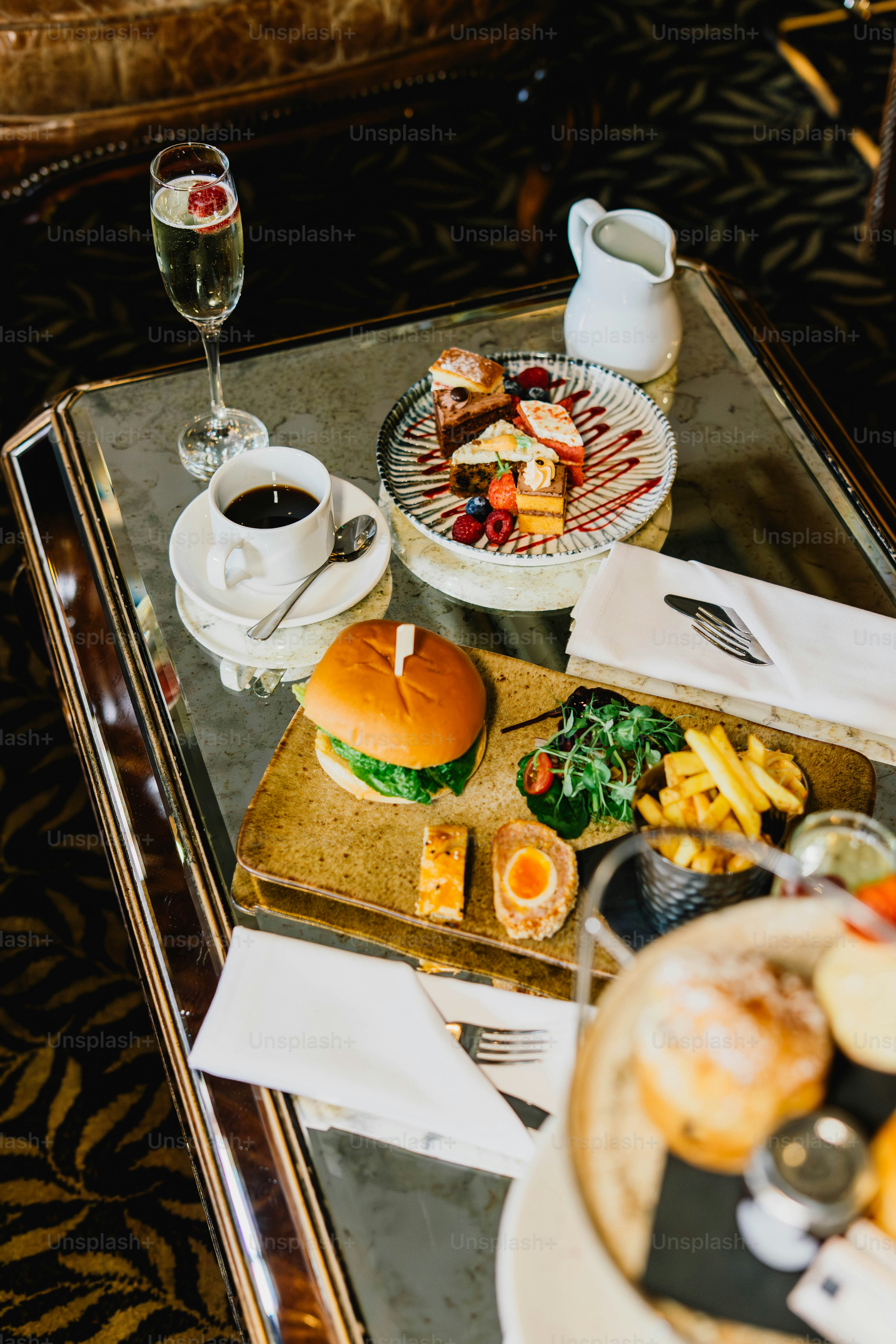 A table with food, drinks, and desserts