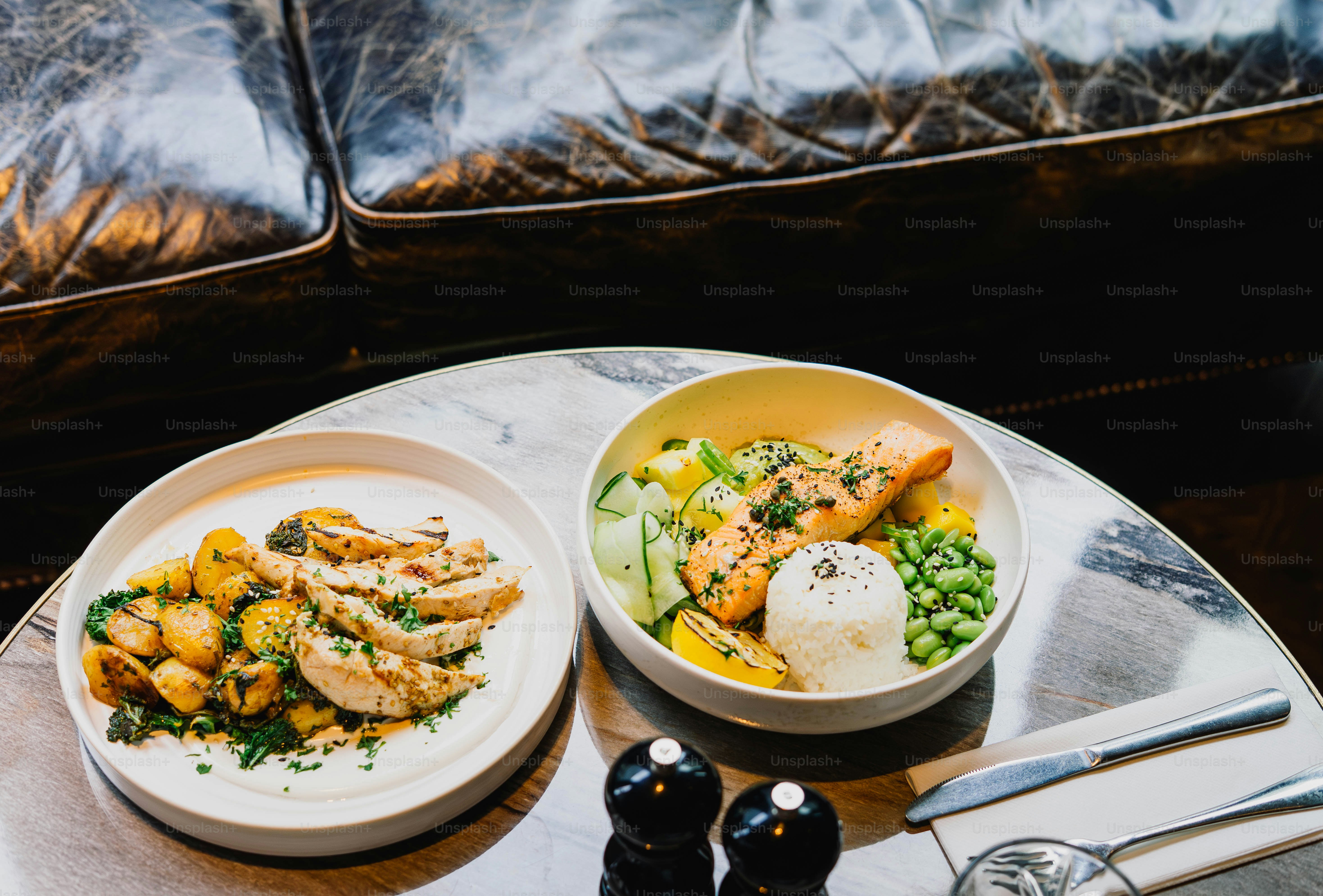 Two healthy meals with chicken and salmon