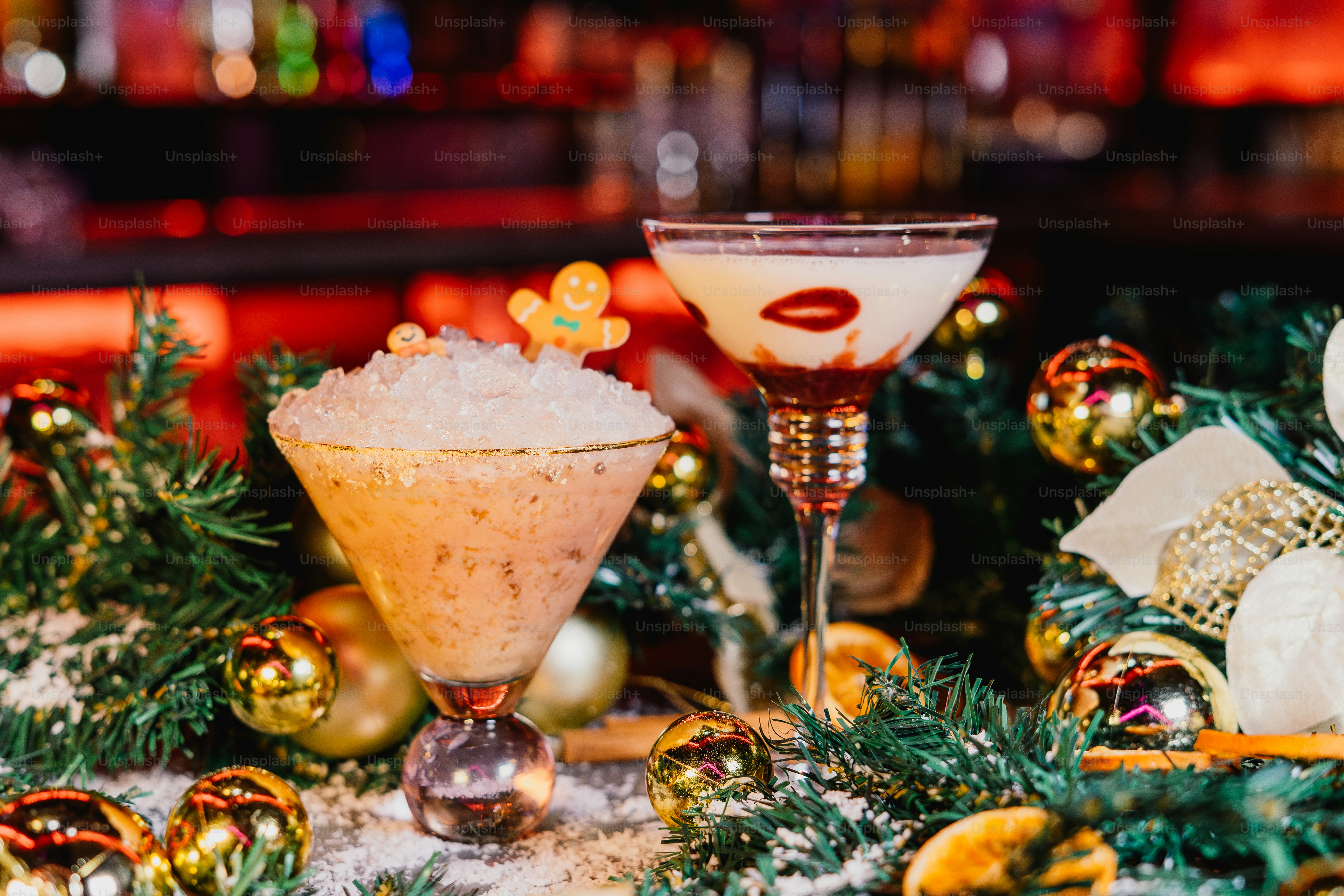 Two festive holiday cocktails with christmas decorations