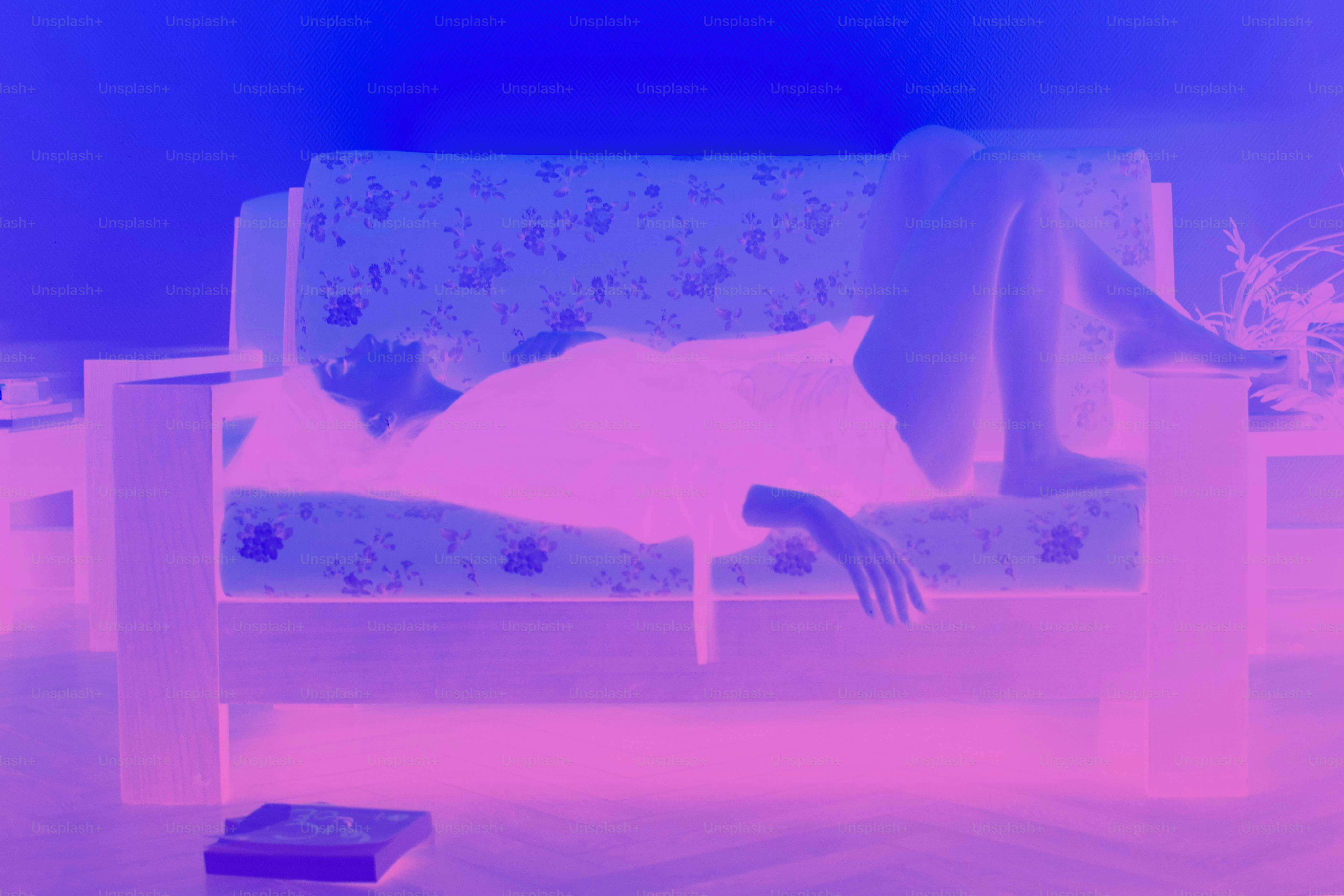 Person relaxing on a patterned couch.