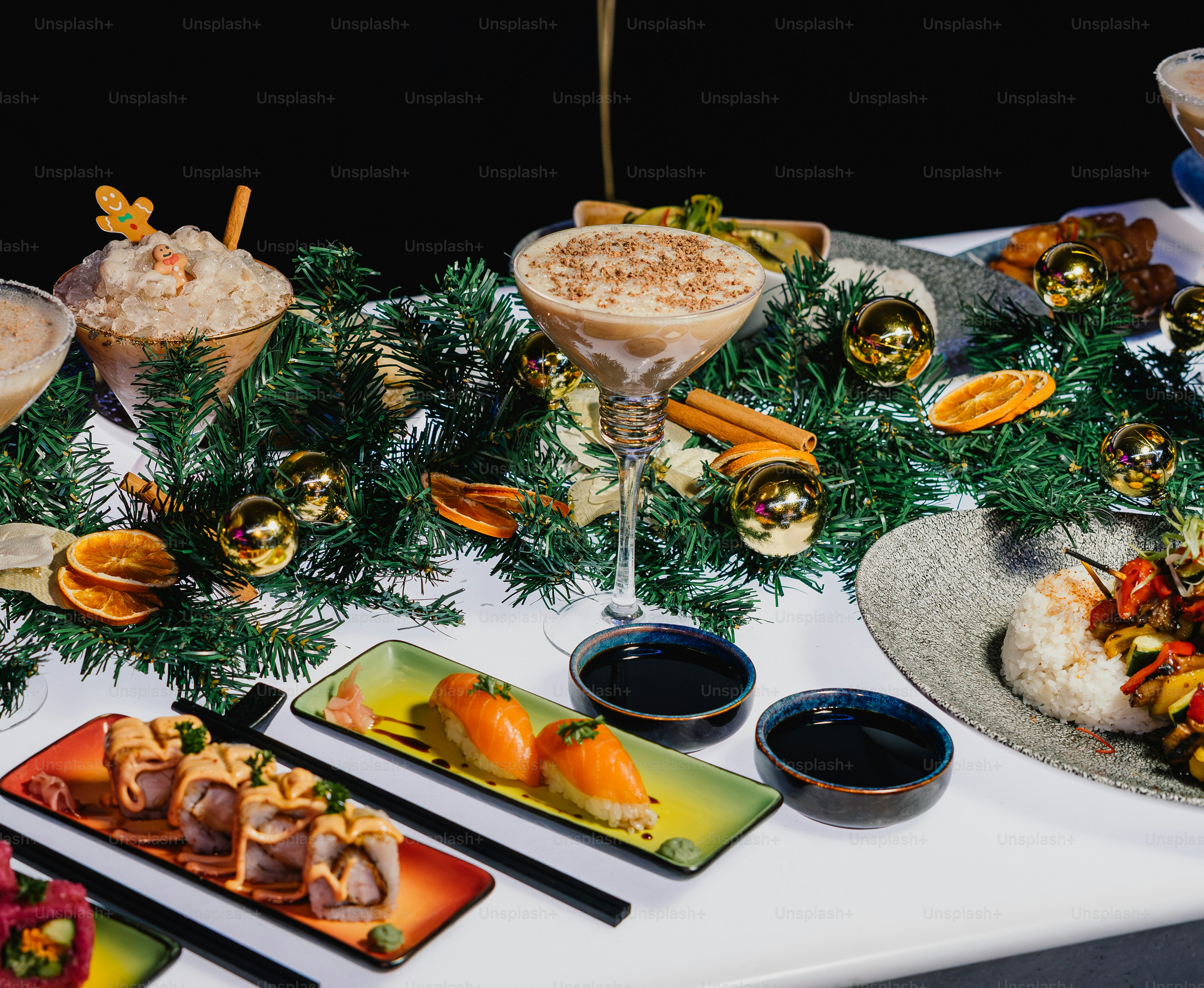 Festive holiday spread with sushi, skewers, and cocktails
