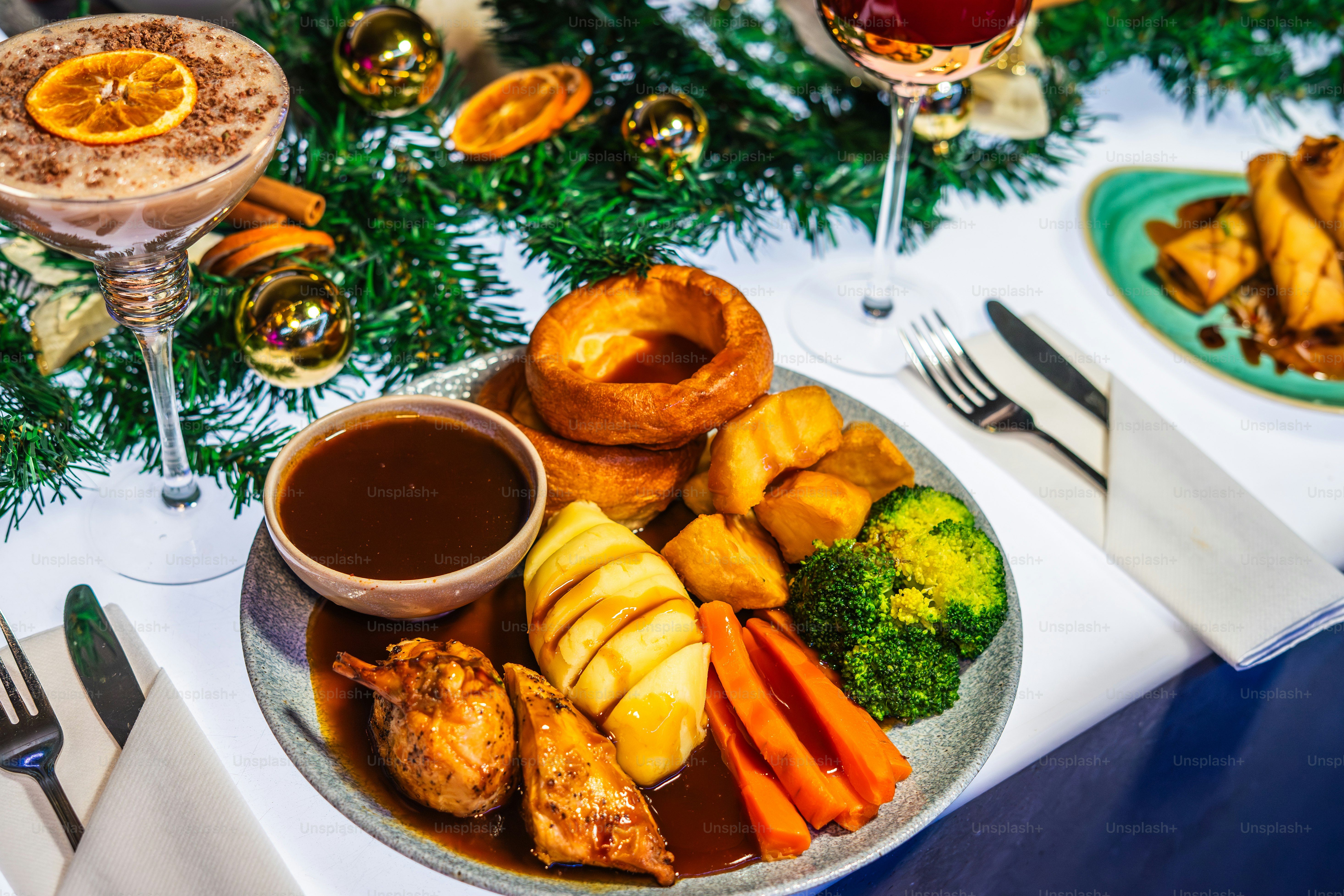 A festive christmas roast dinner with vegetables and gravy.