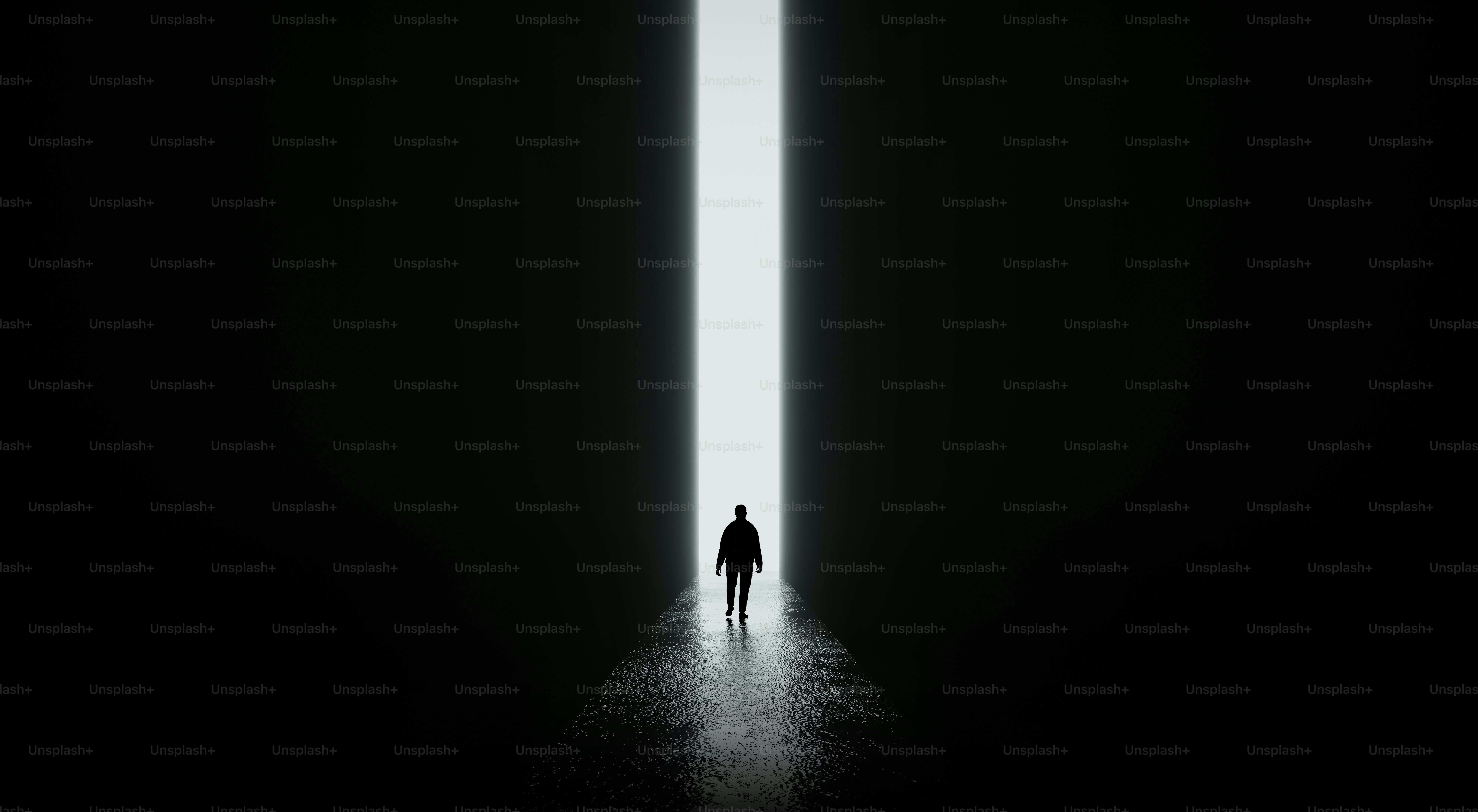 Silhouette of a person walking towards a bright light