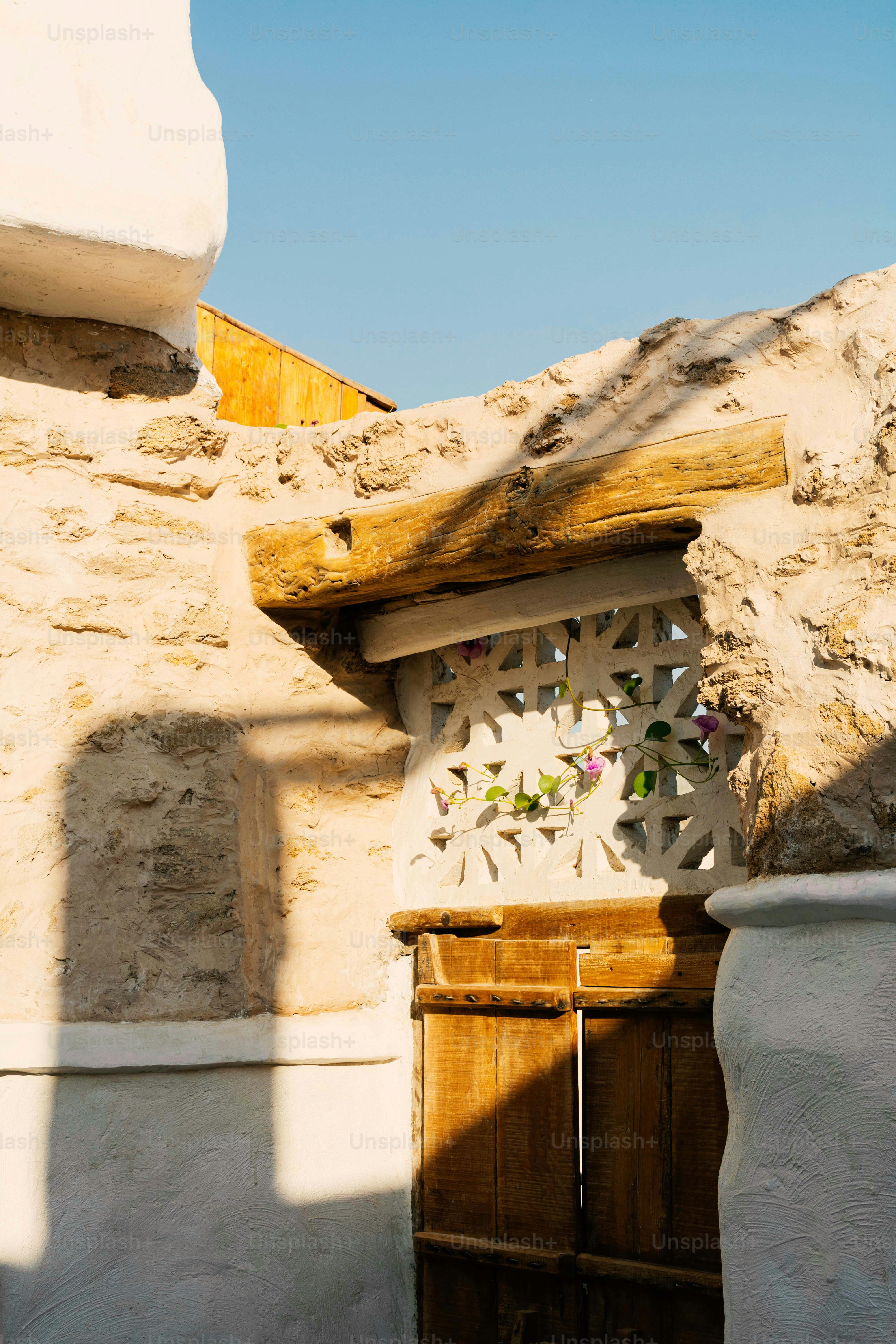 Traditional architecture with wooden door and blue sky