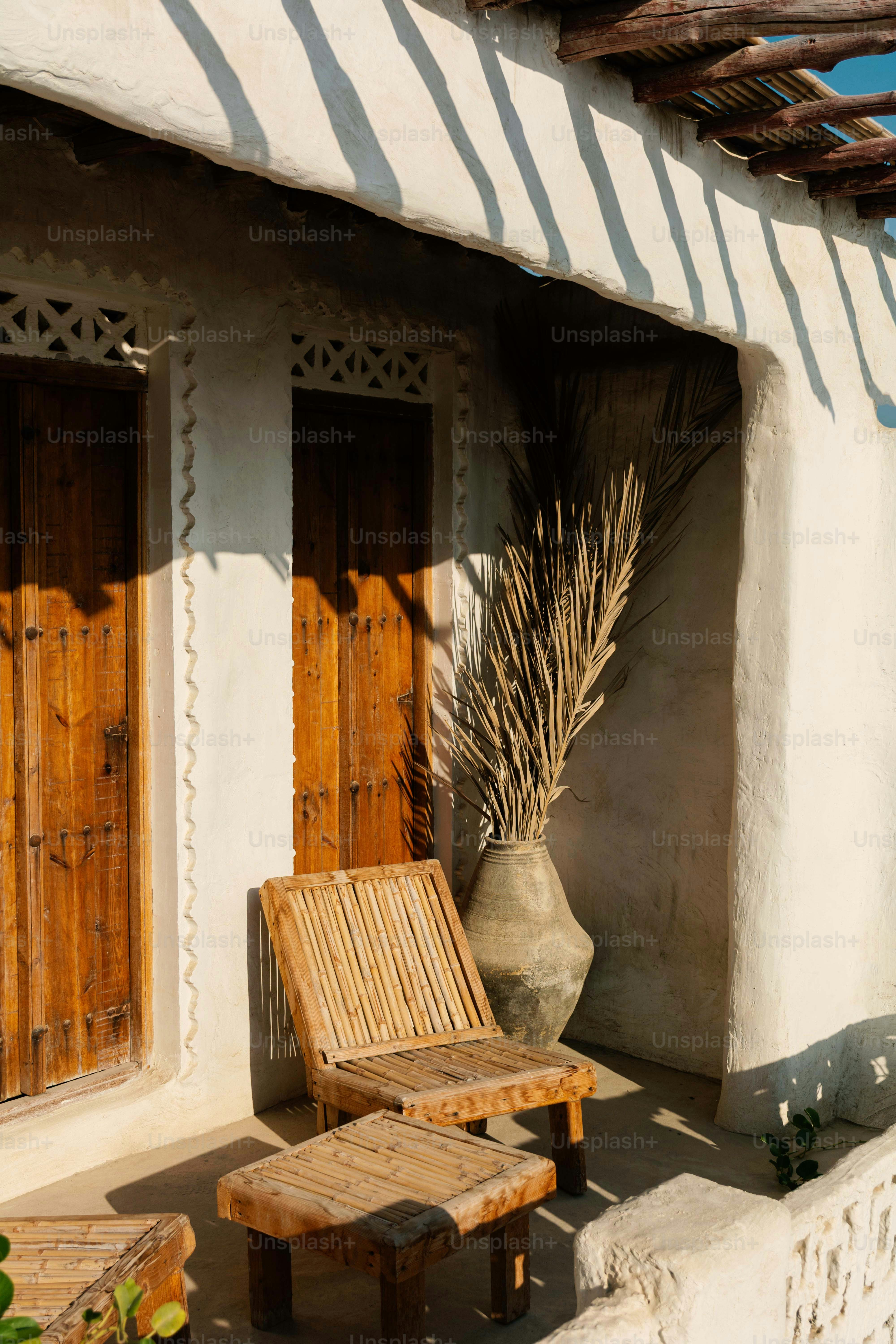 Wooden chair and table on a sunny patio.