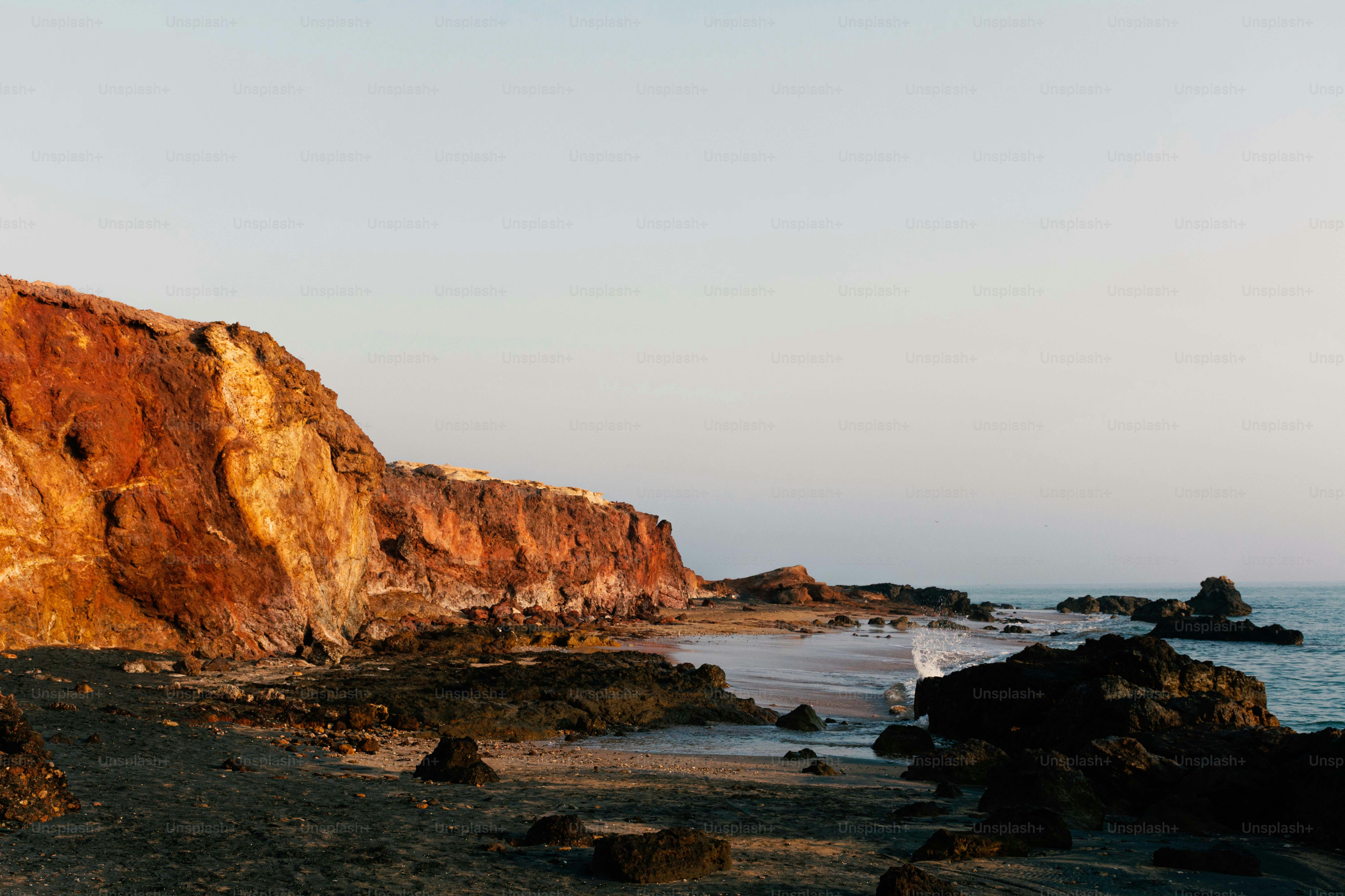 Rocky coastline with cliffs at sunset