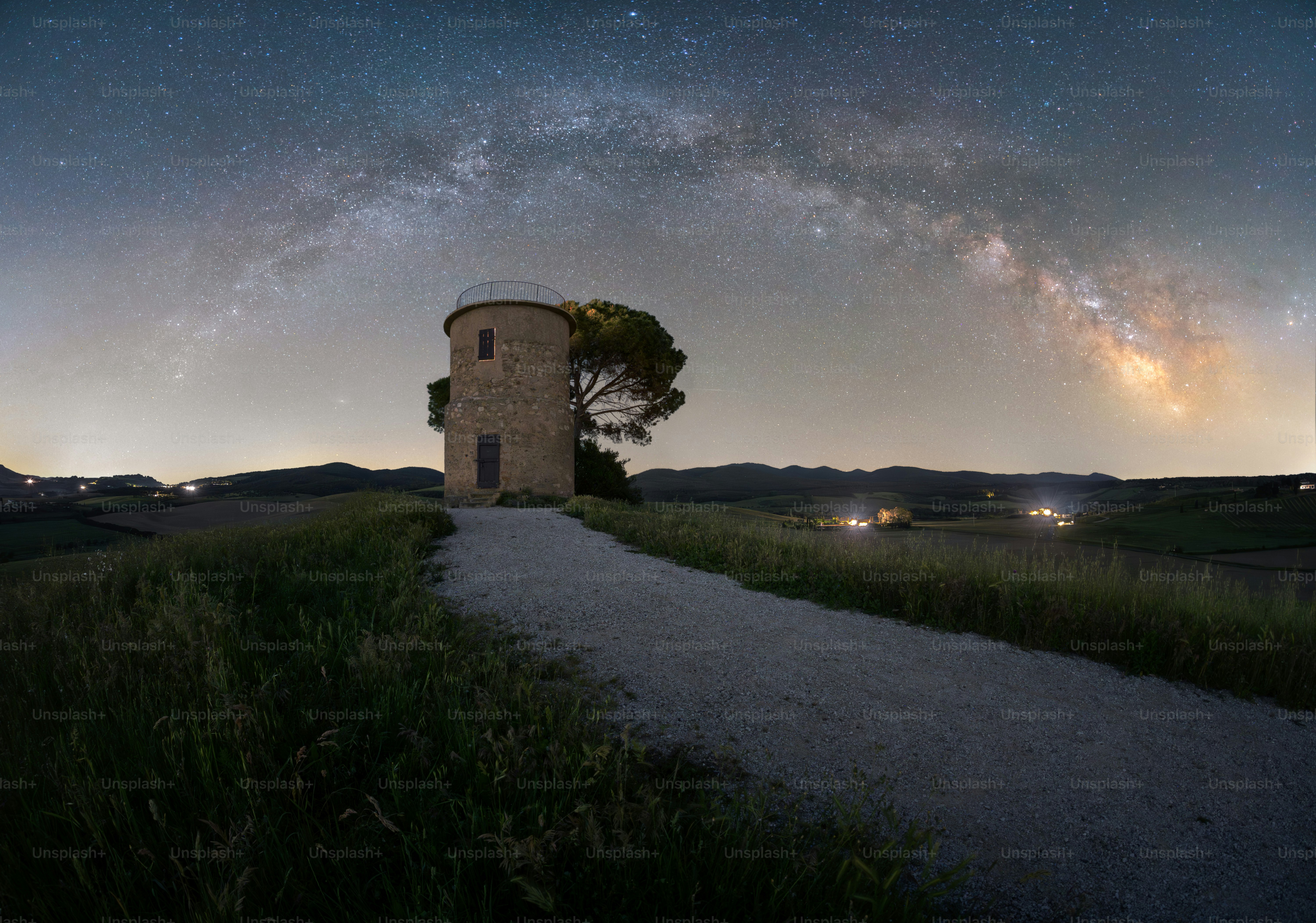 Stone tower under the milky way at night.
