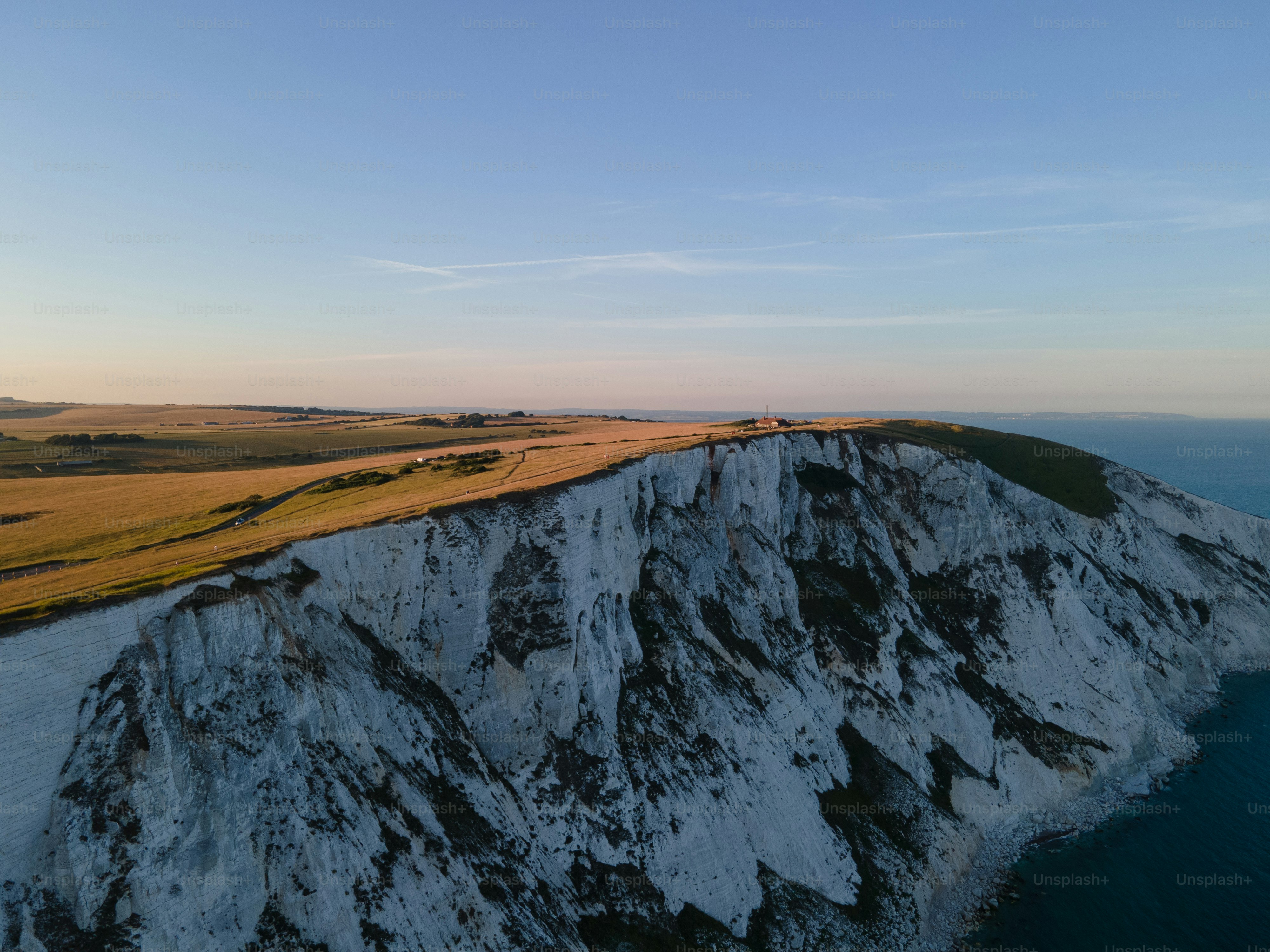 White cliffs overlooking the ocean at sunset