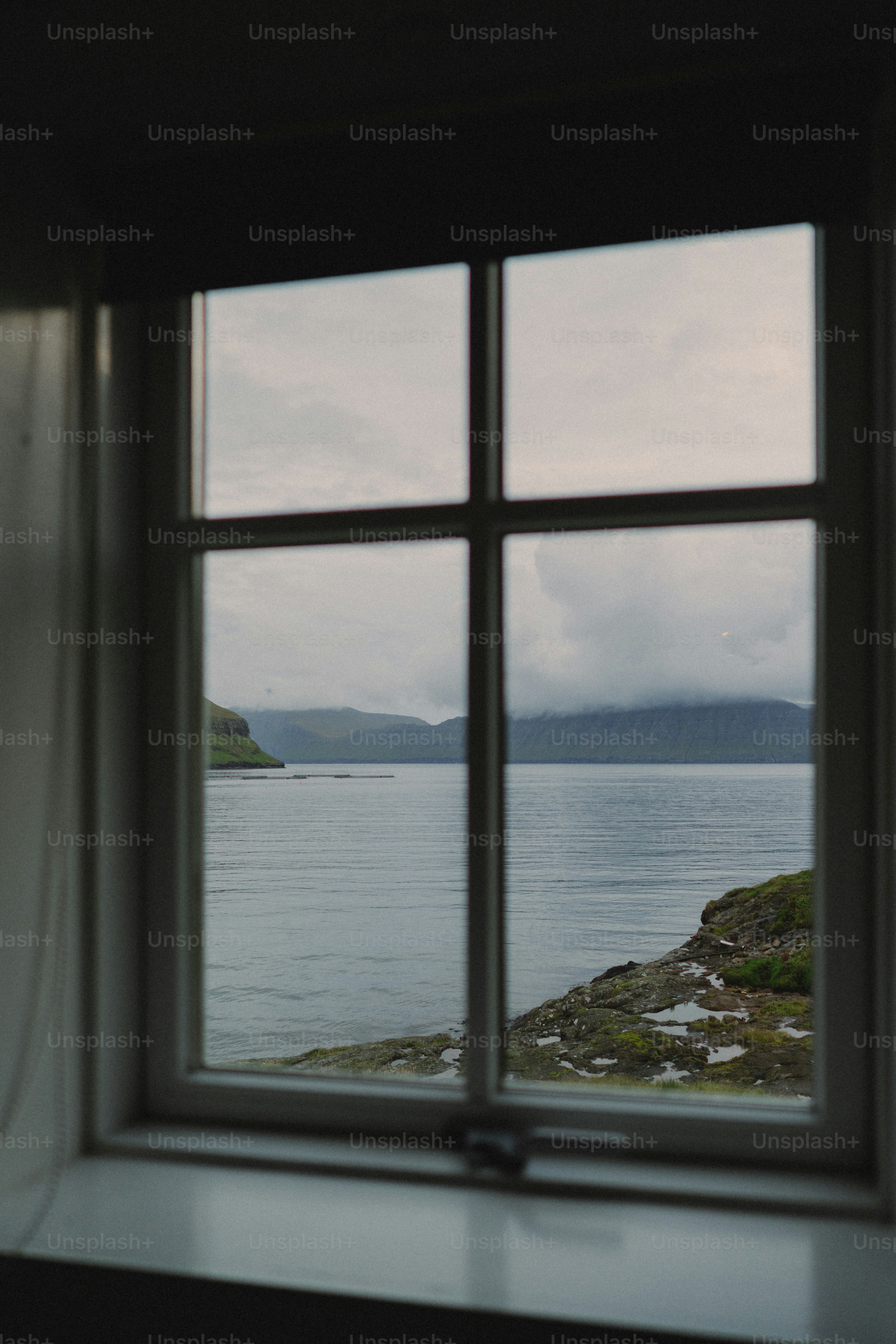 View of a calm bay through a window