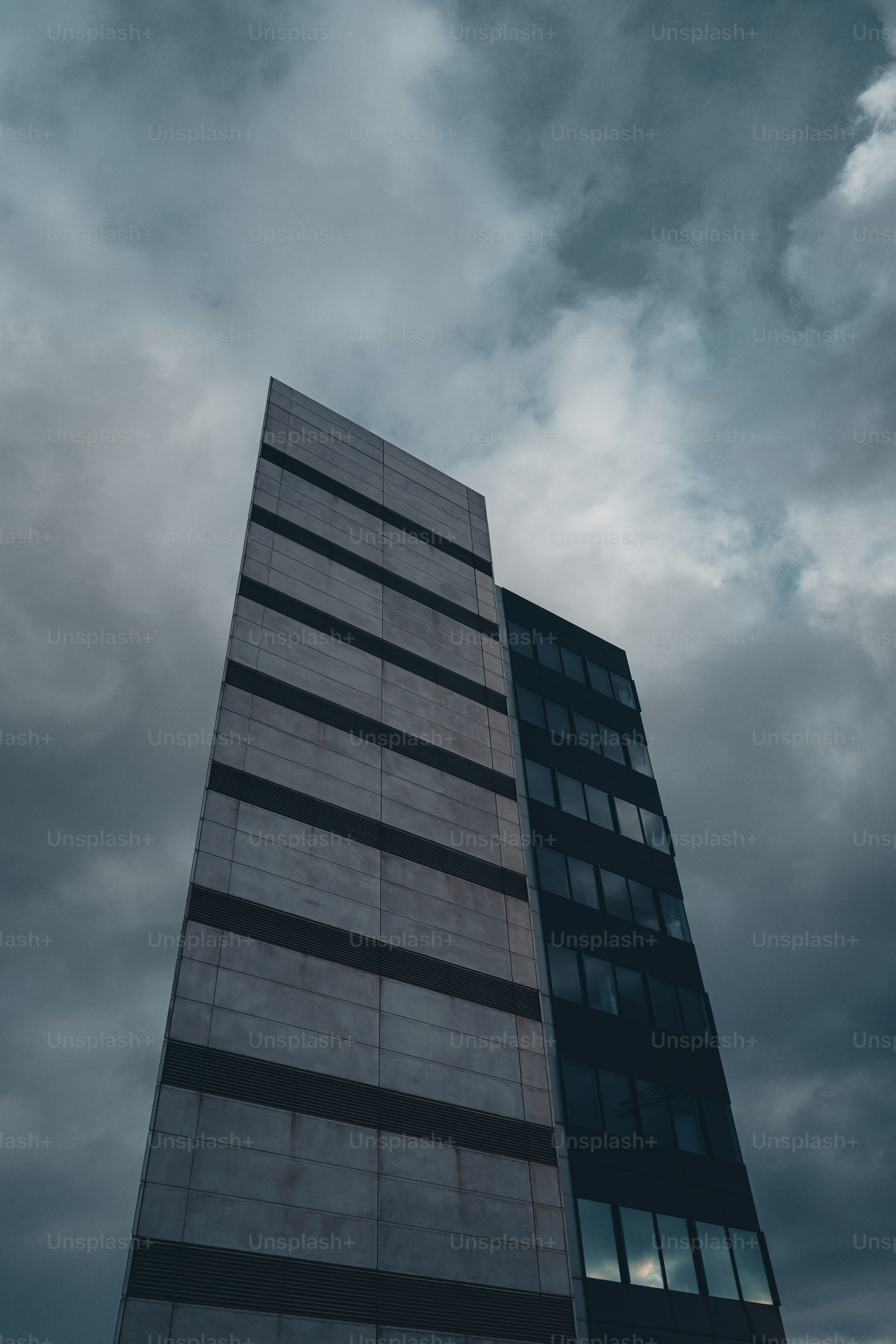 Modern concrete building against cloudy sky