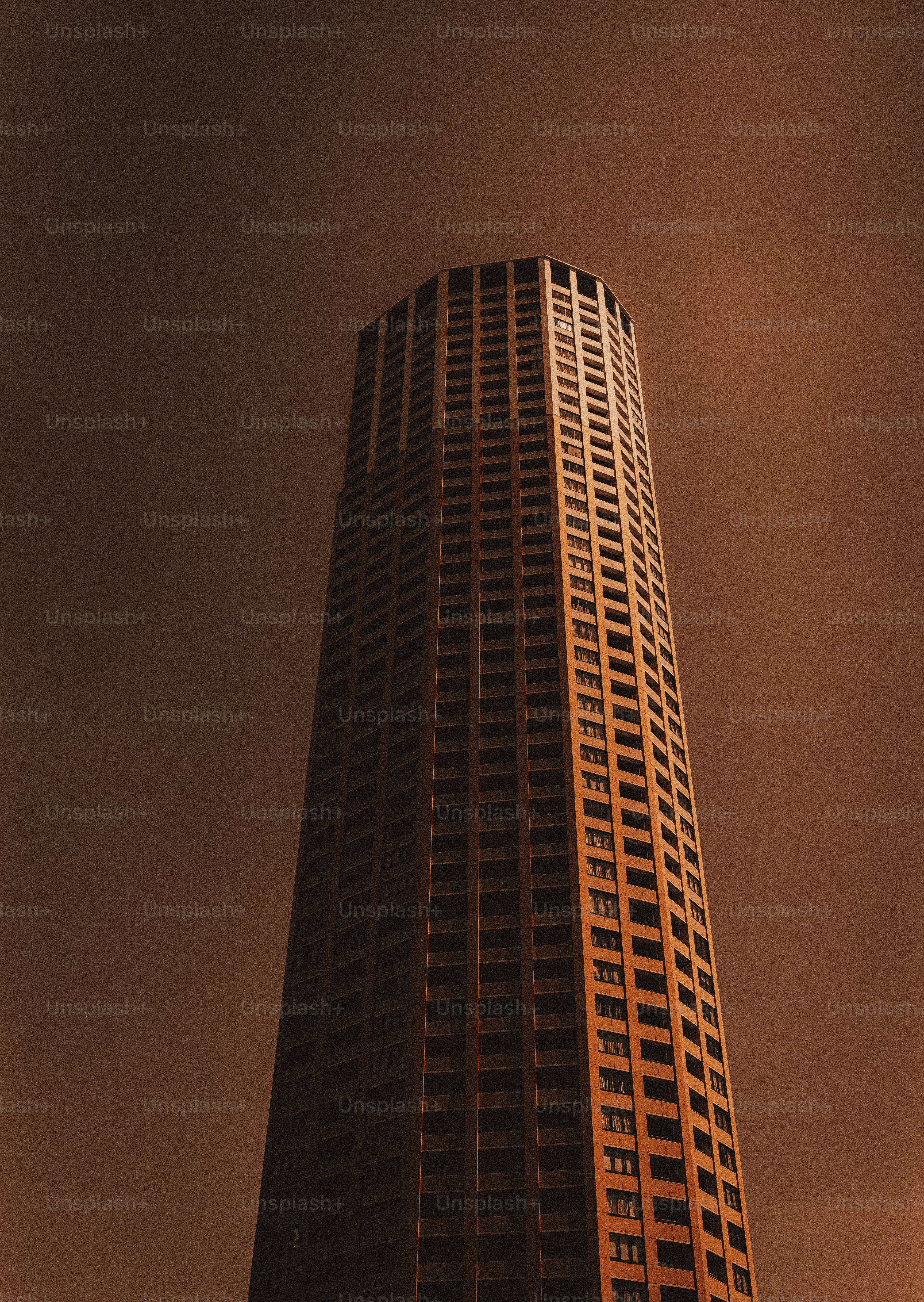 Tall skyscraper against a hazy sky