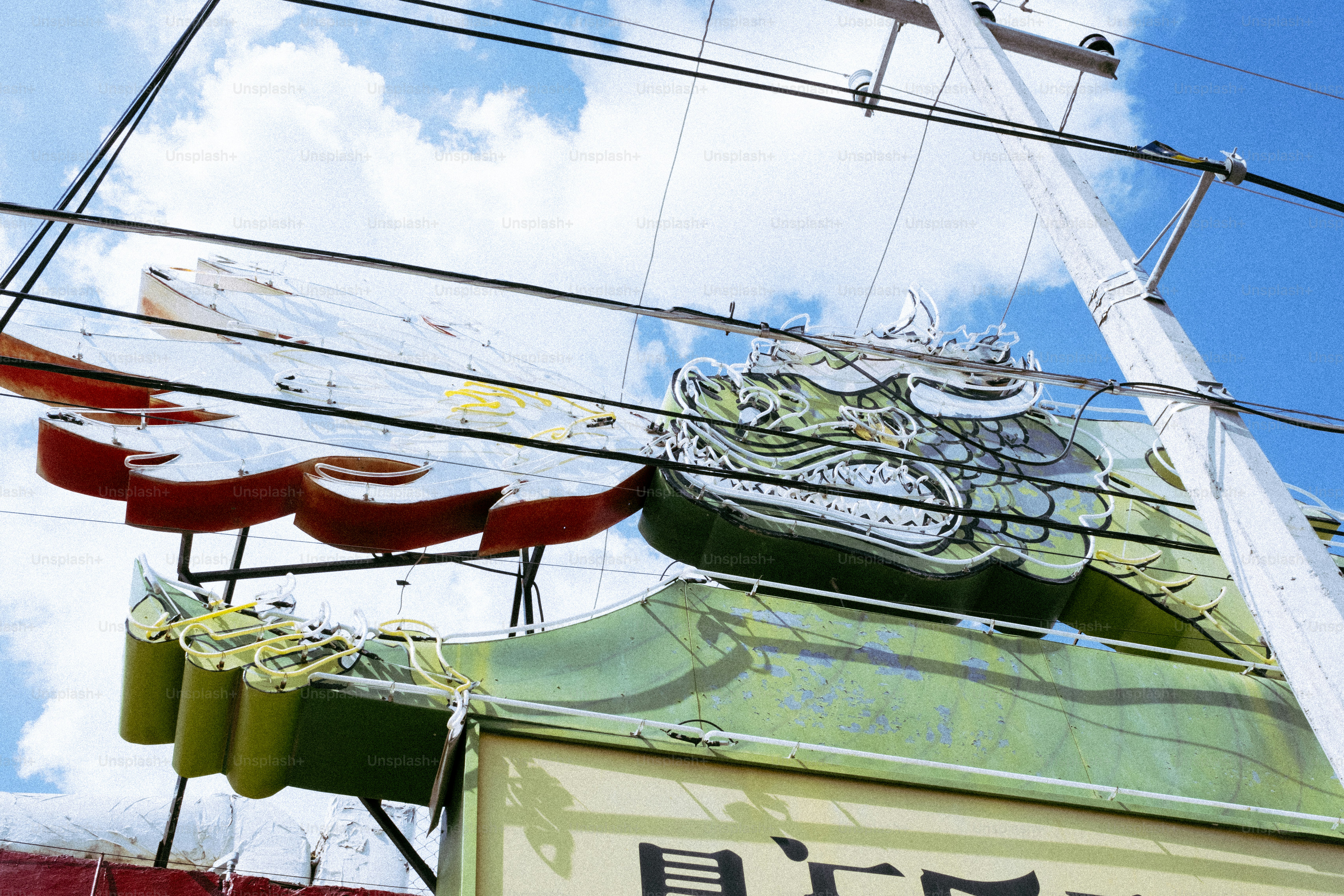 Dragon sign on a building under blue sky