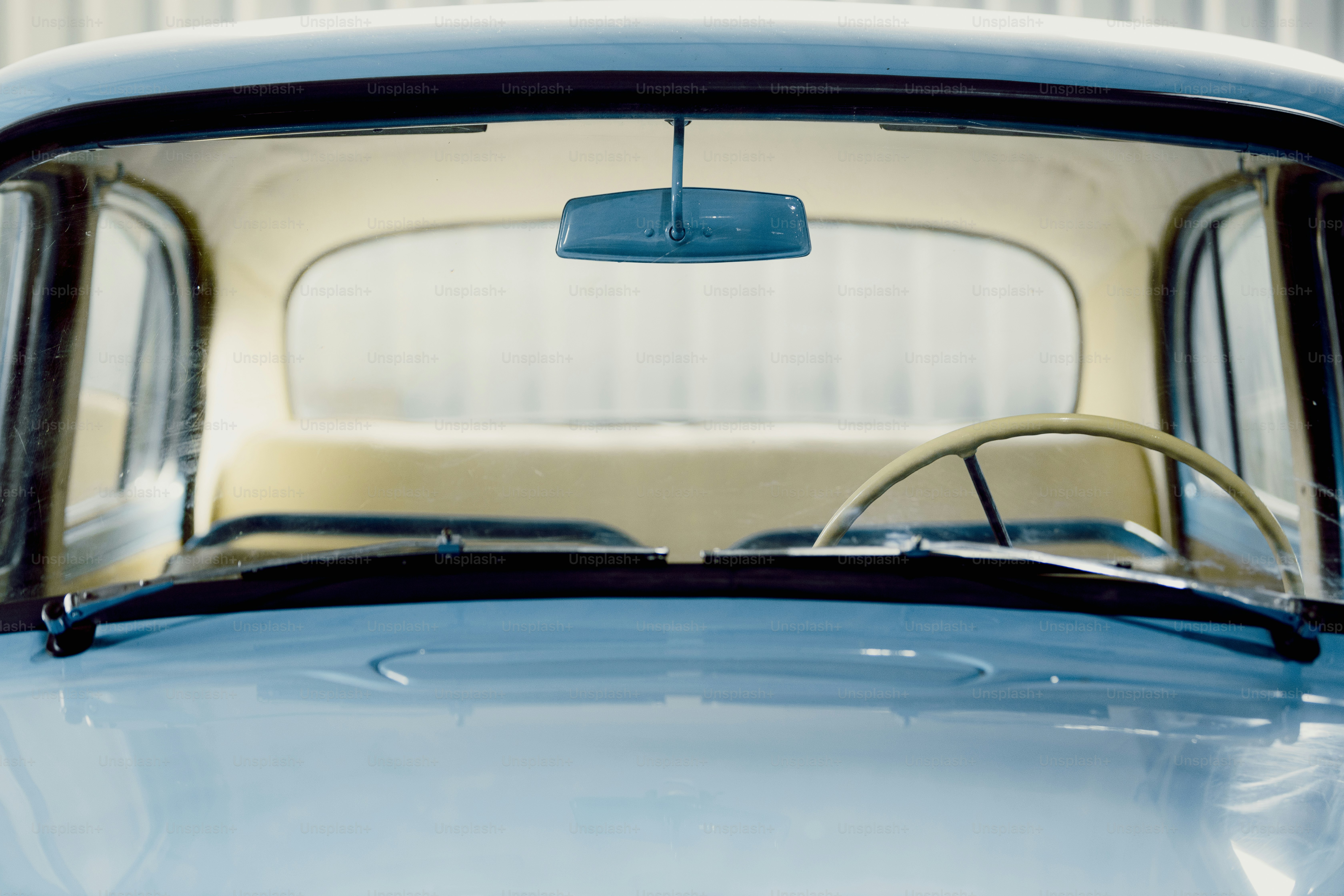 Front view of a vintage blue car interior