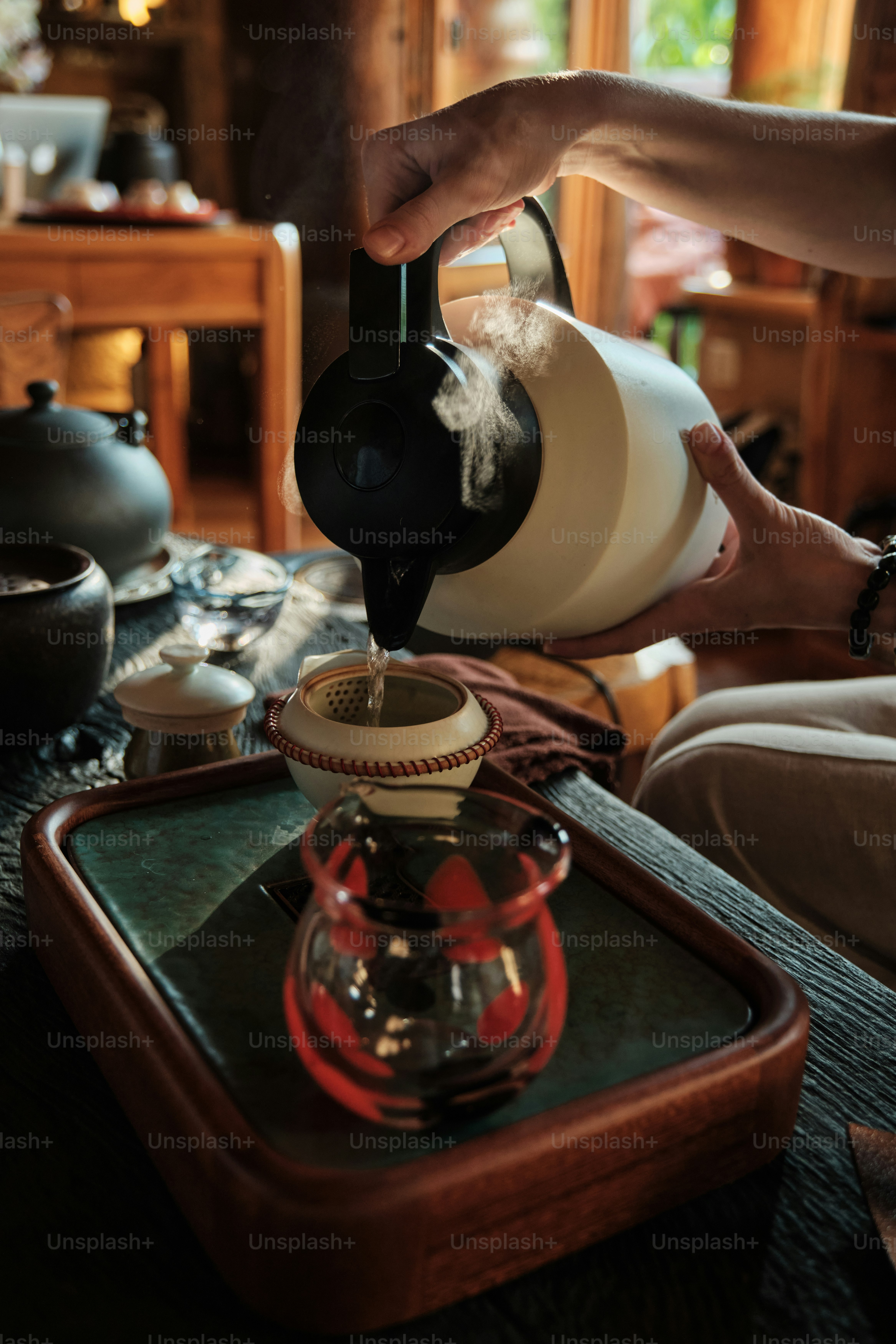 Steaming hot water poured into a tea cup
