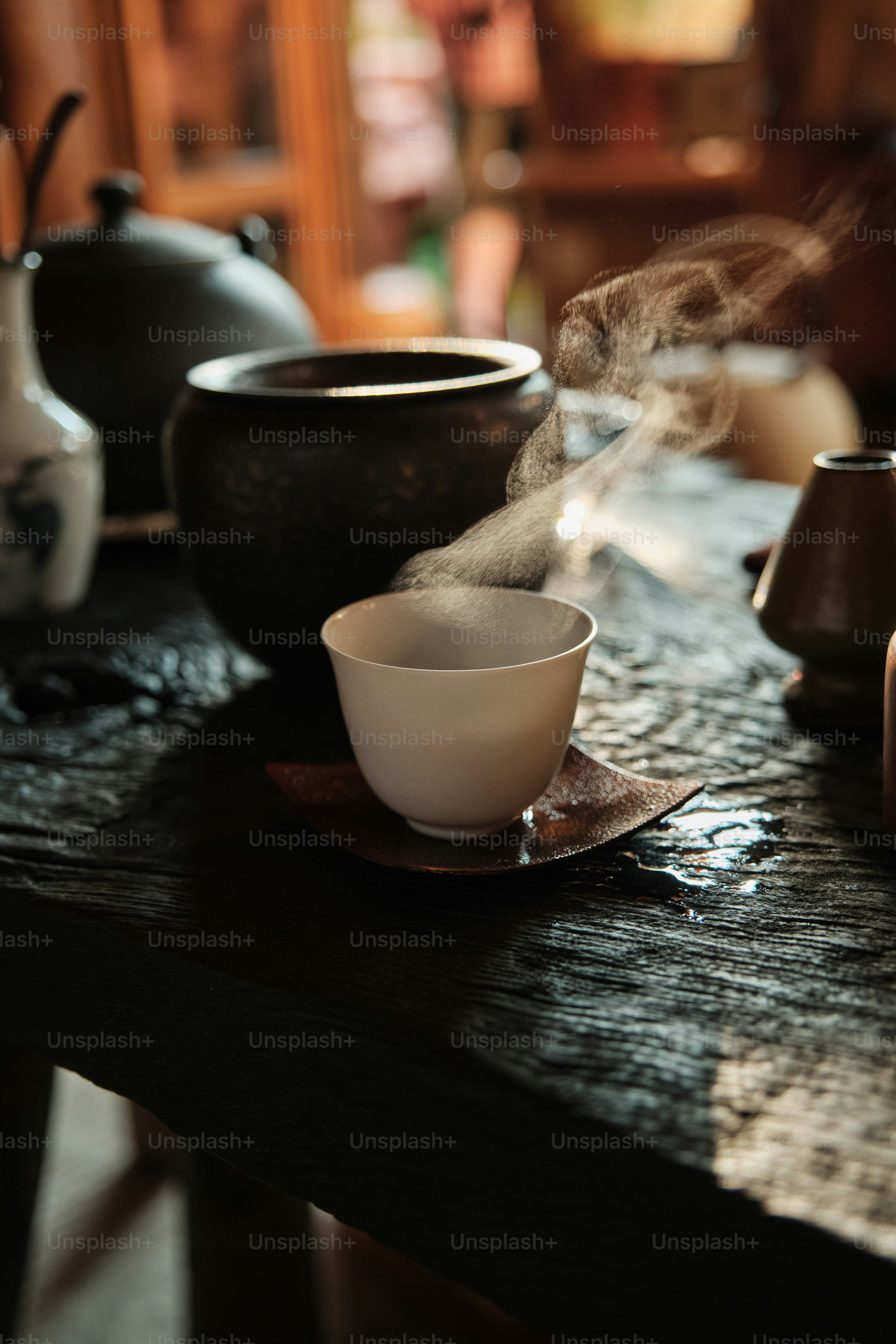 Steaming tea cup on a rustic wooden table photo – Green Image on Unsplash