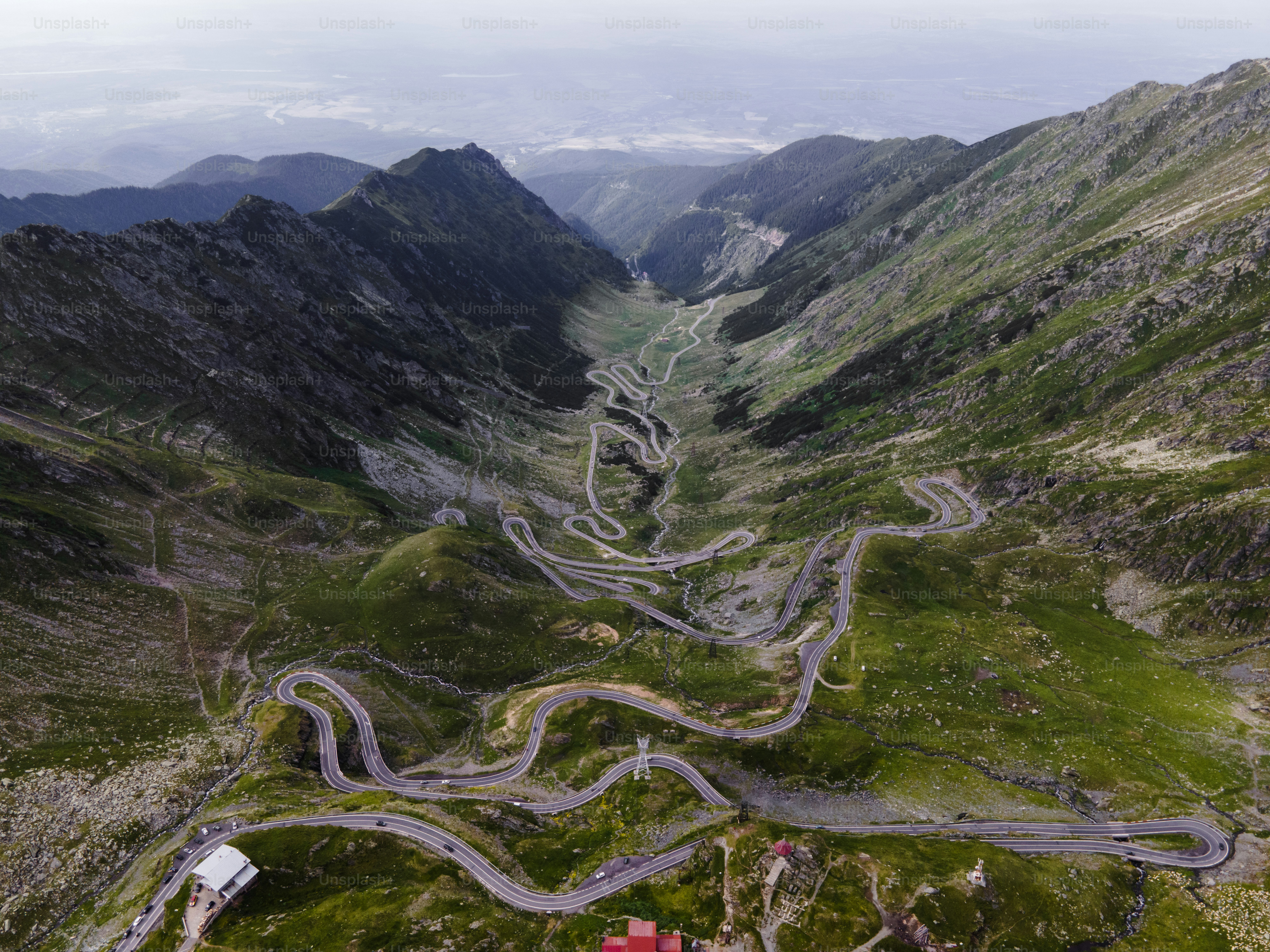 Winding mountain road through green valleys