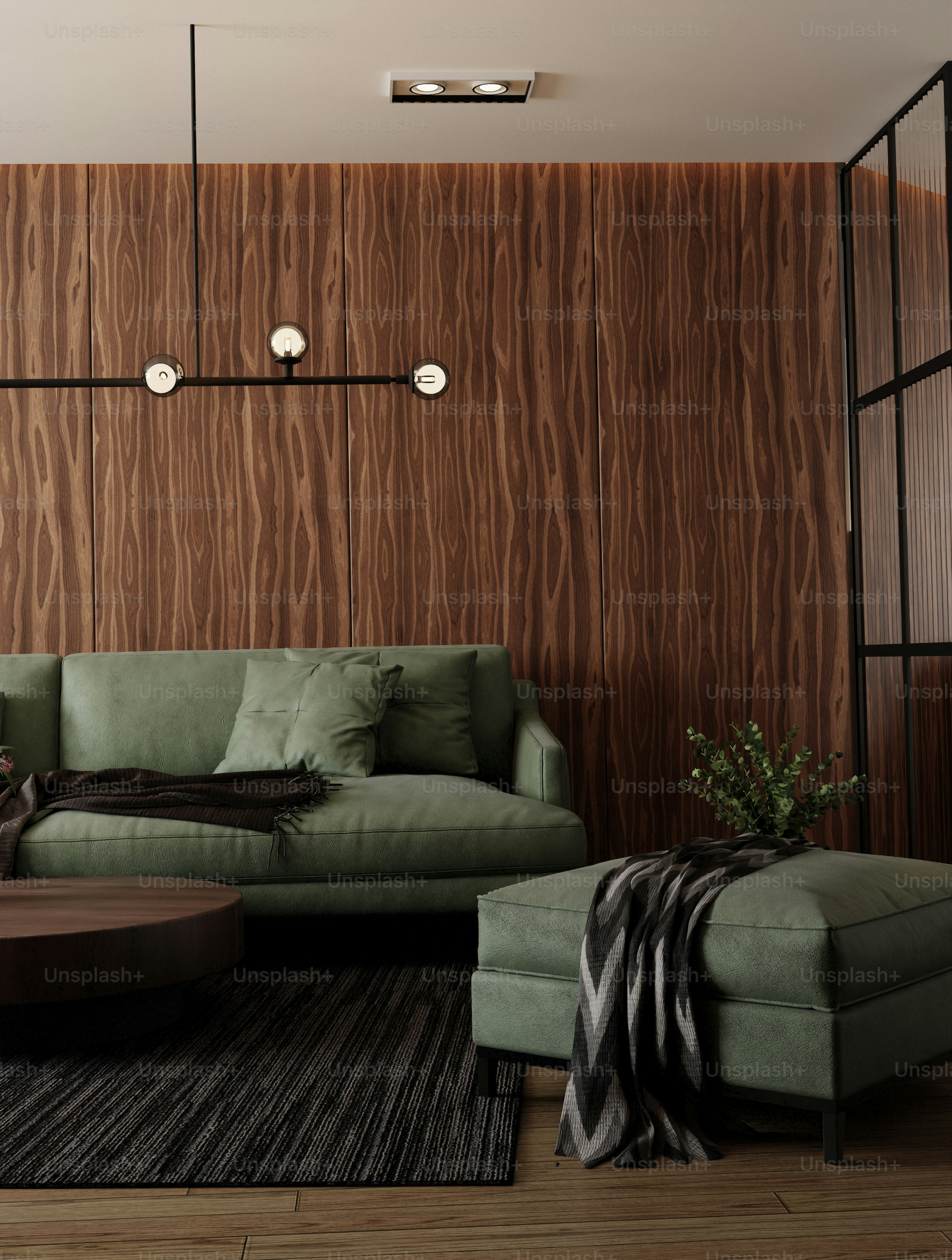 Modern living room with green sofa and wood paneling wall. photo ...