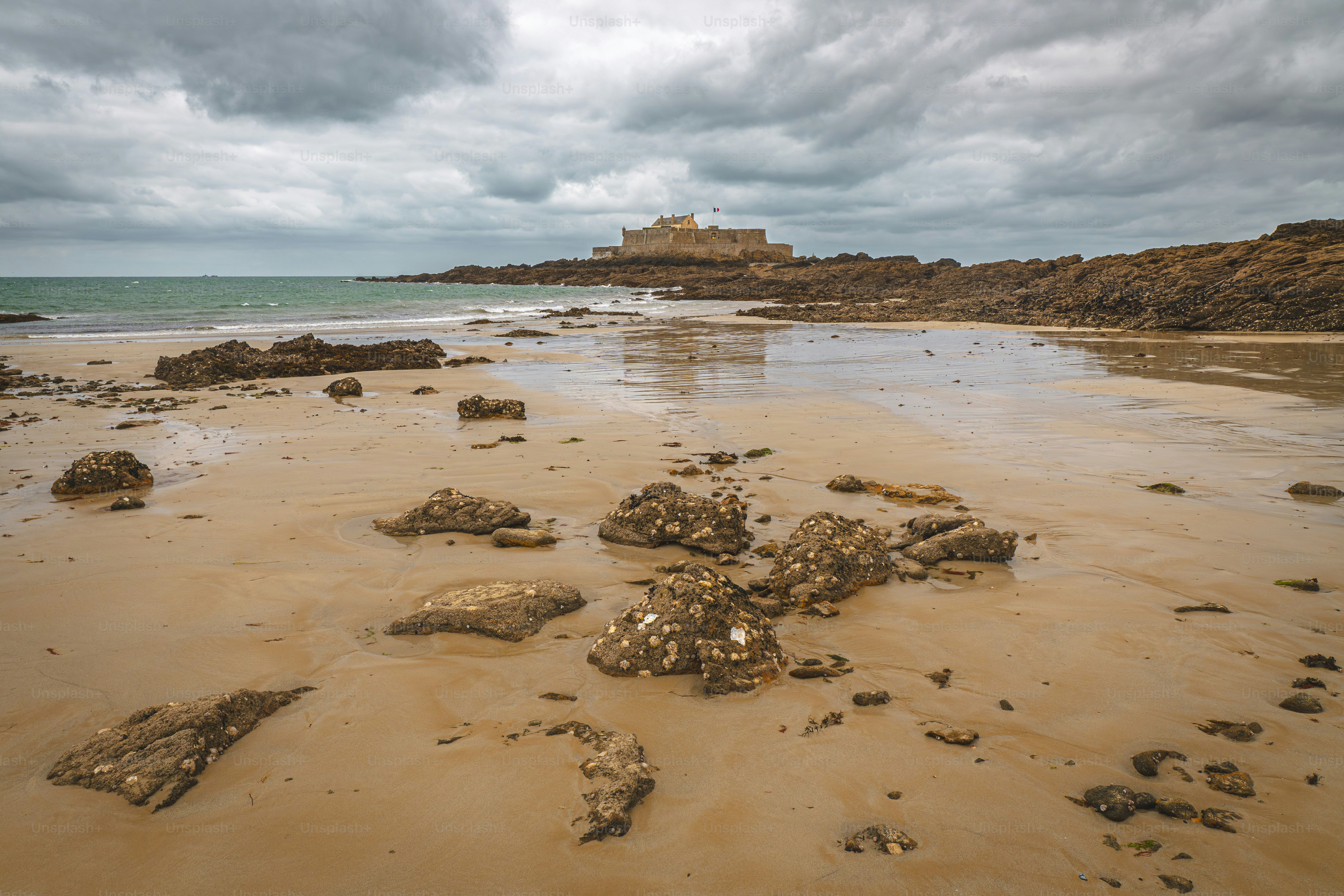 Fortress on rocky island under cloudy sky