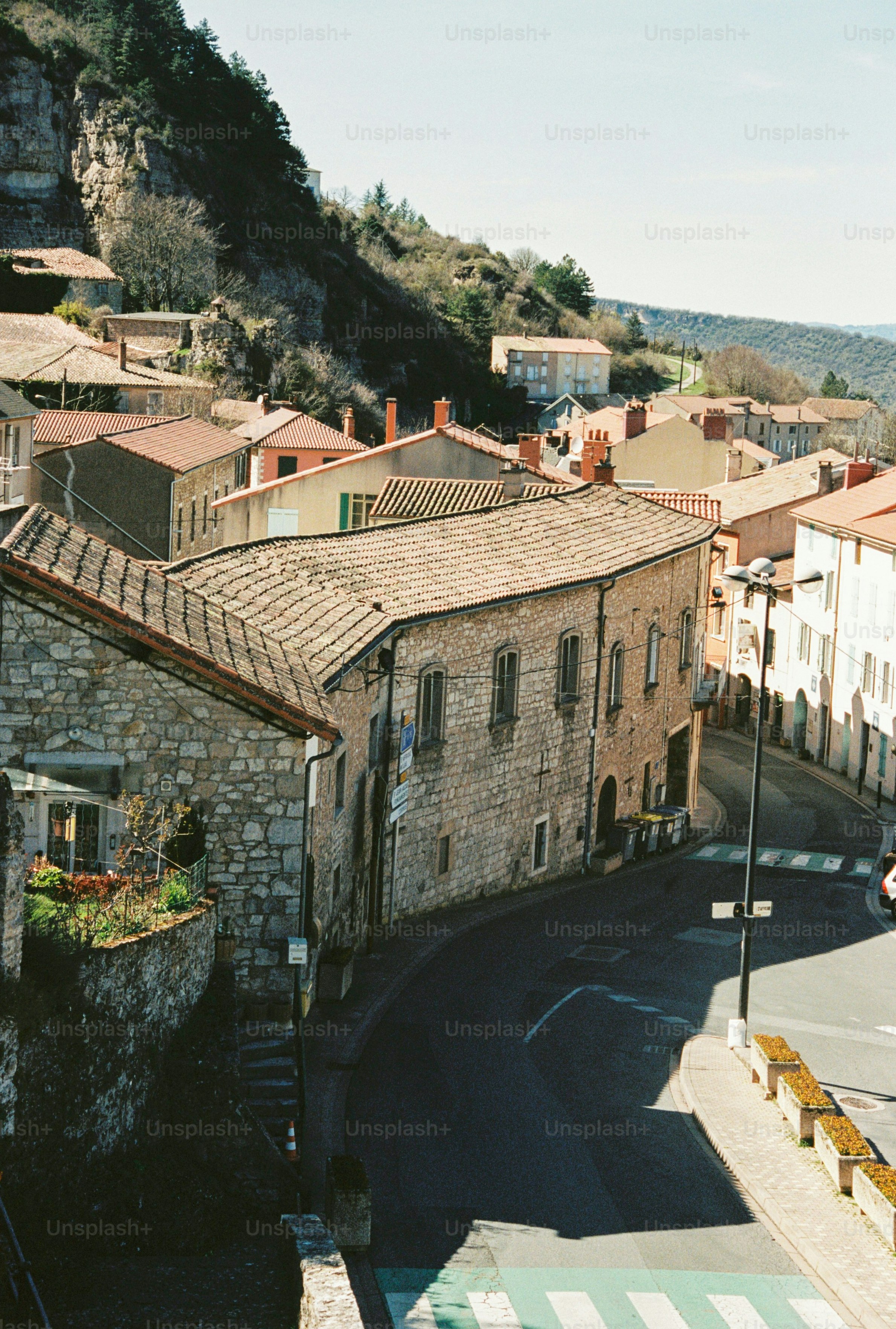 A quaint village nestled on a hillside with winding streets.