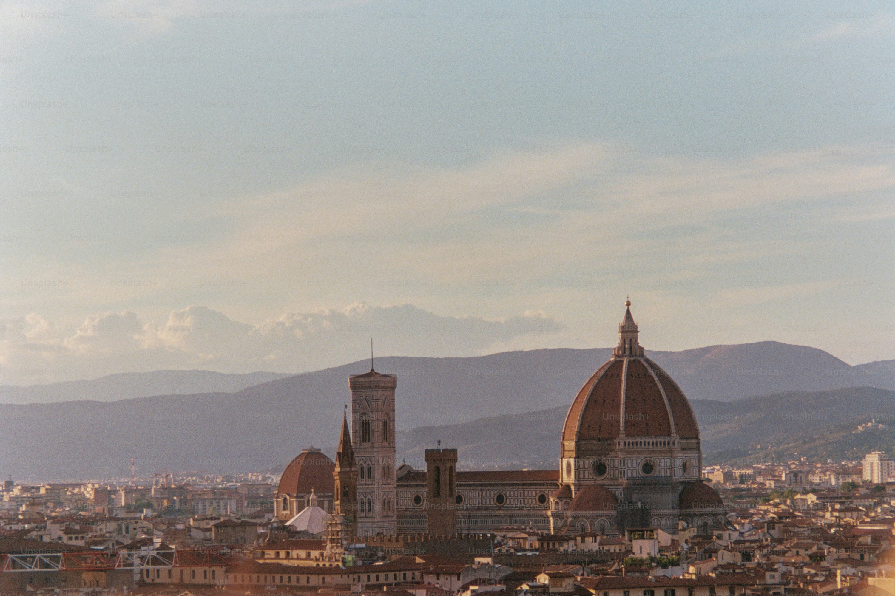 Florence cityscape with duomo and distant mountains