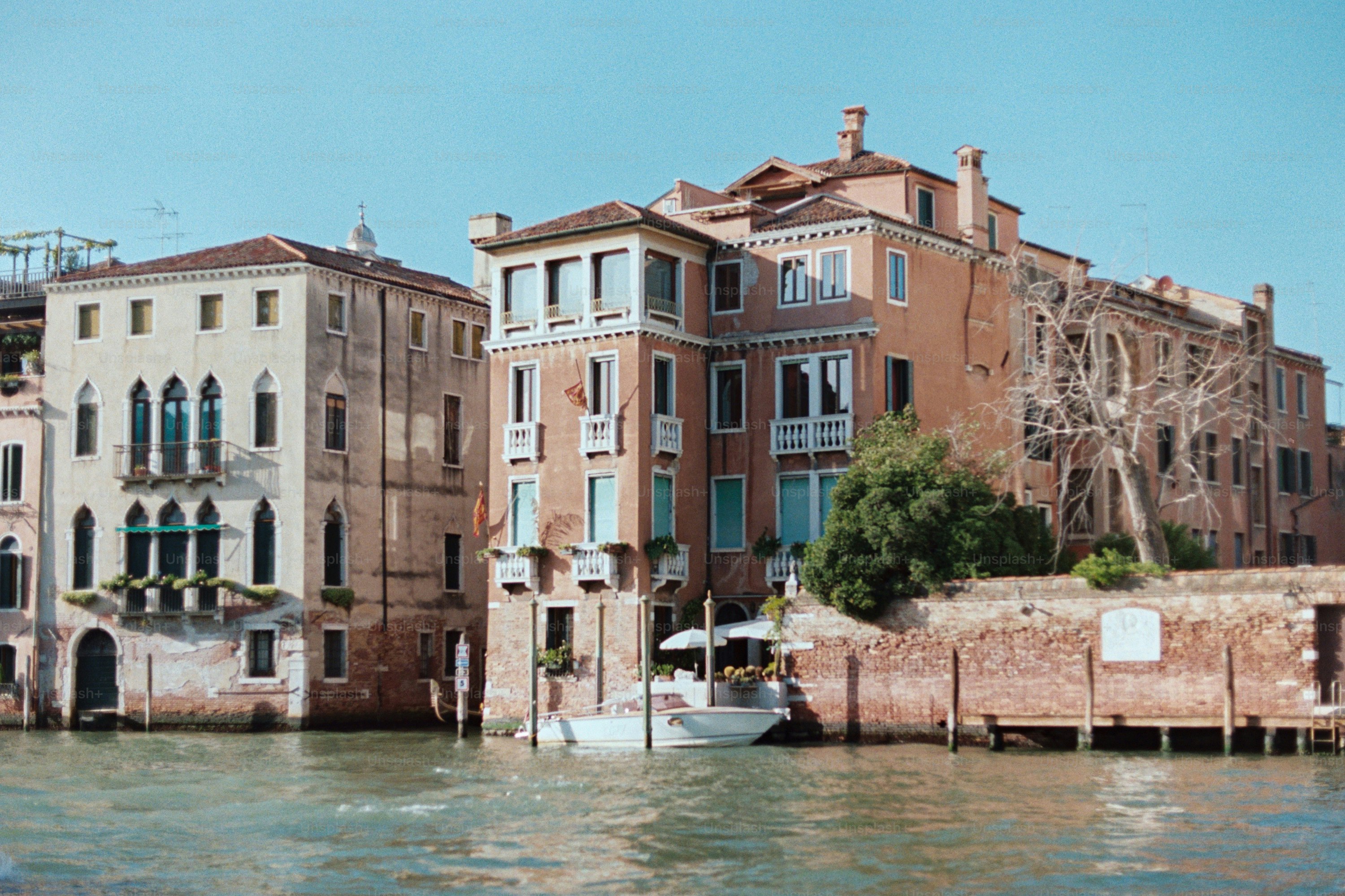 Buildings on a canal with a boat.