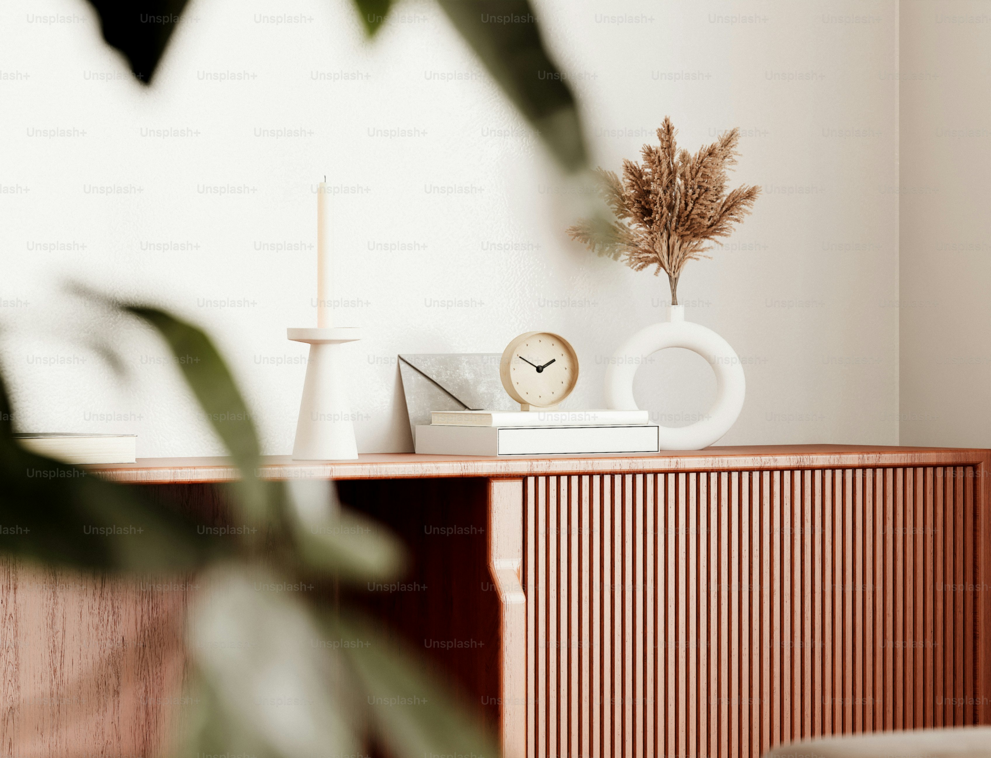 Decorated wooden cabinet with vase and clock