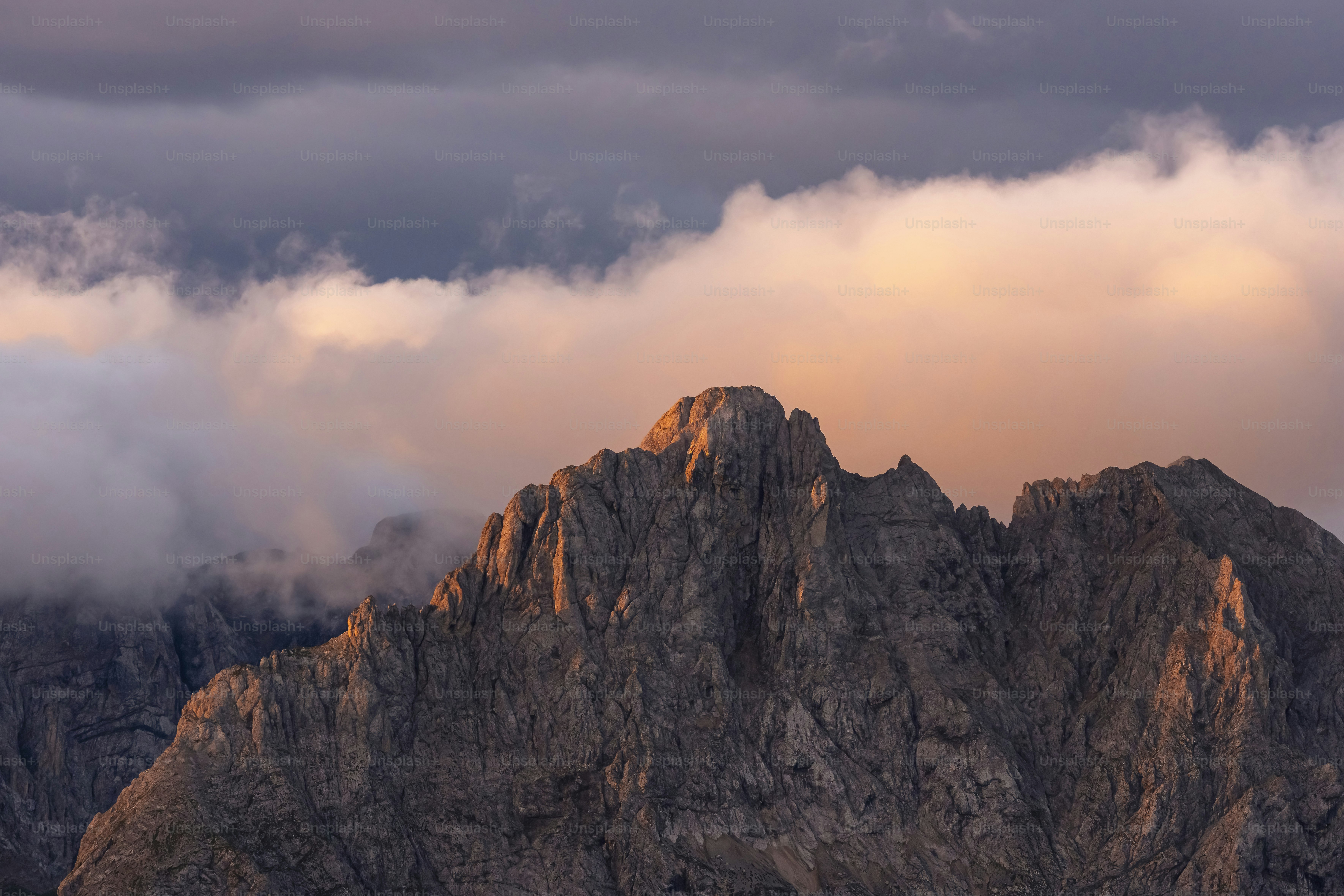 Jagged mountain peak bathed in warm sunset light