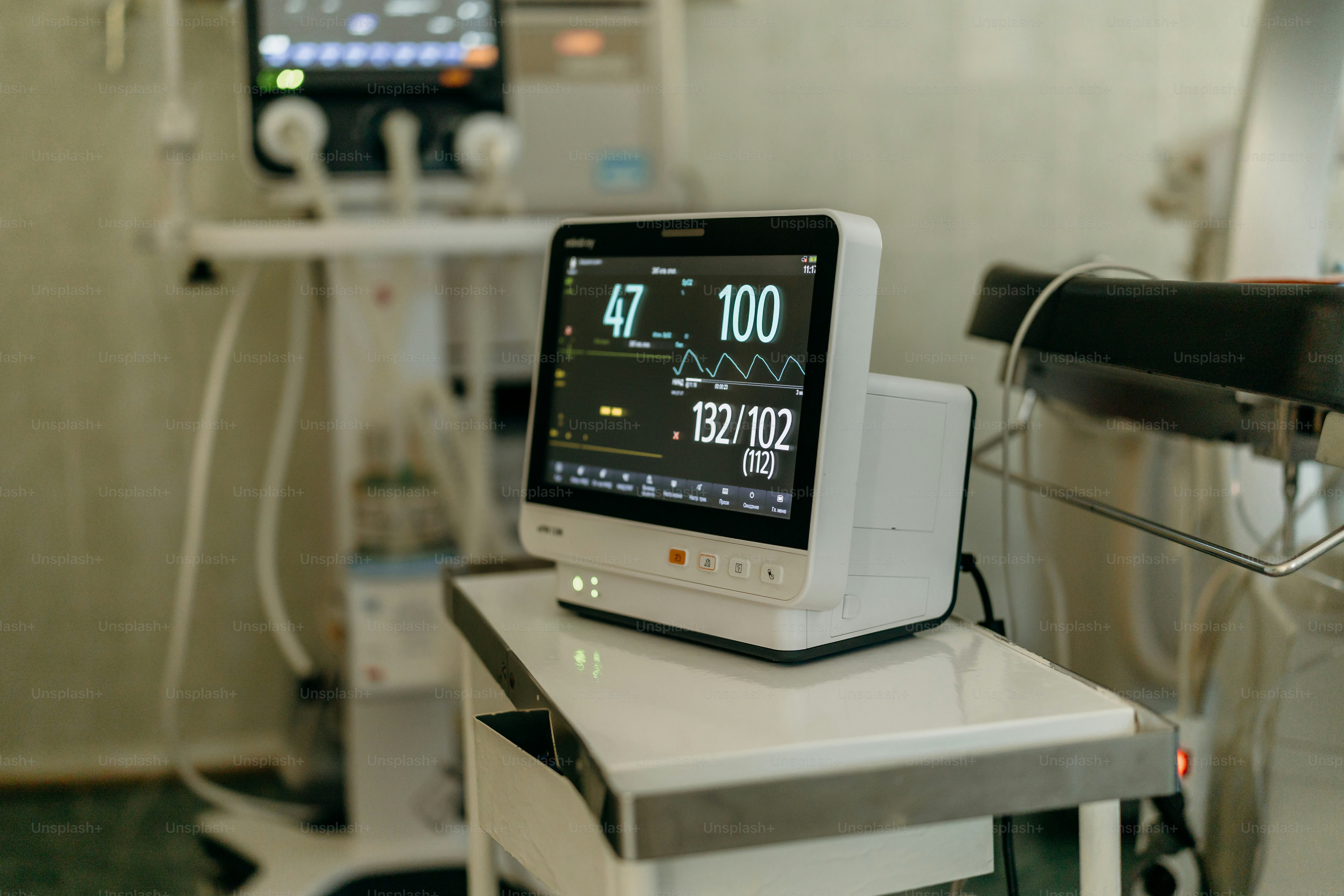 Medical monitor displaying vital signs in a hospital room