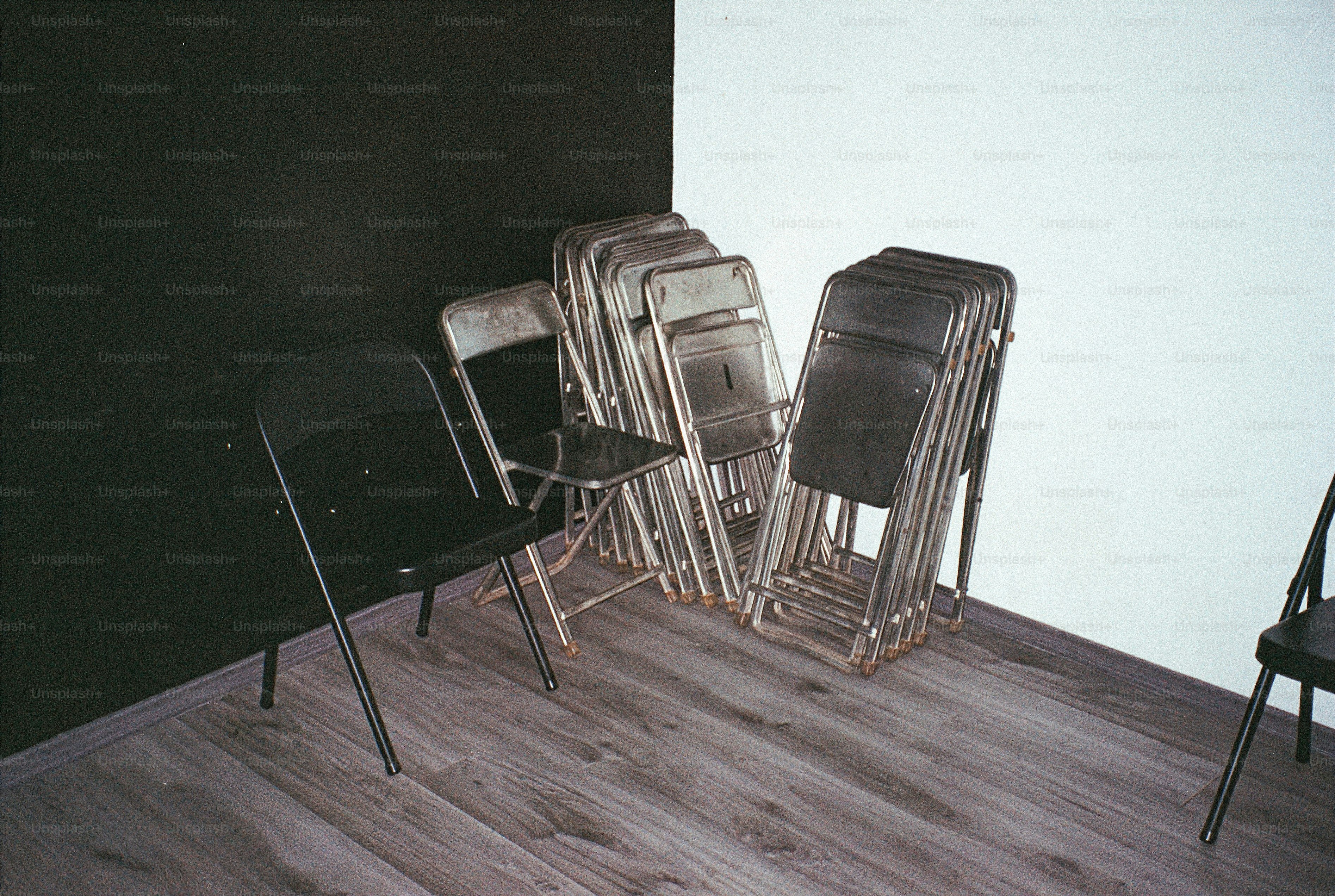 Stacked folding chairs in a corner
