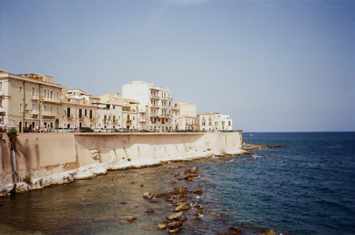 A dramatic coastline being reshaped by rising waters, documented before the change is complete