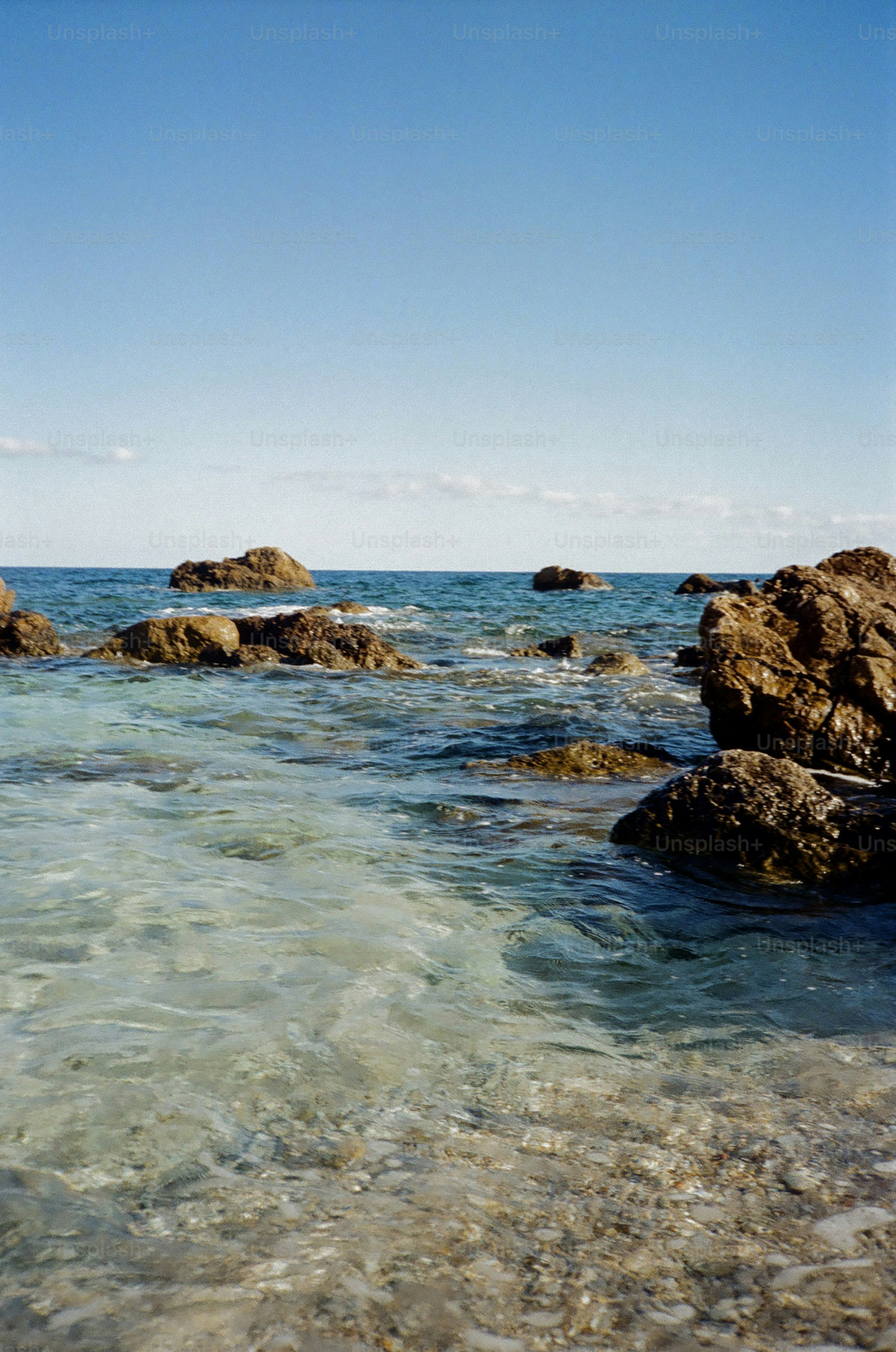 Rocky coastline with clear blue ocean water