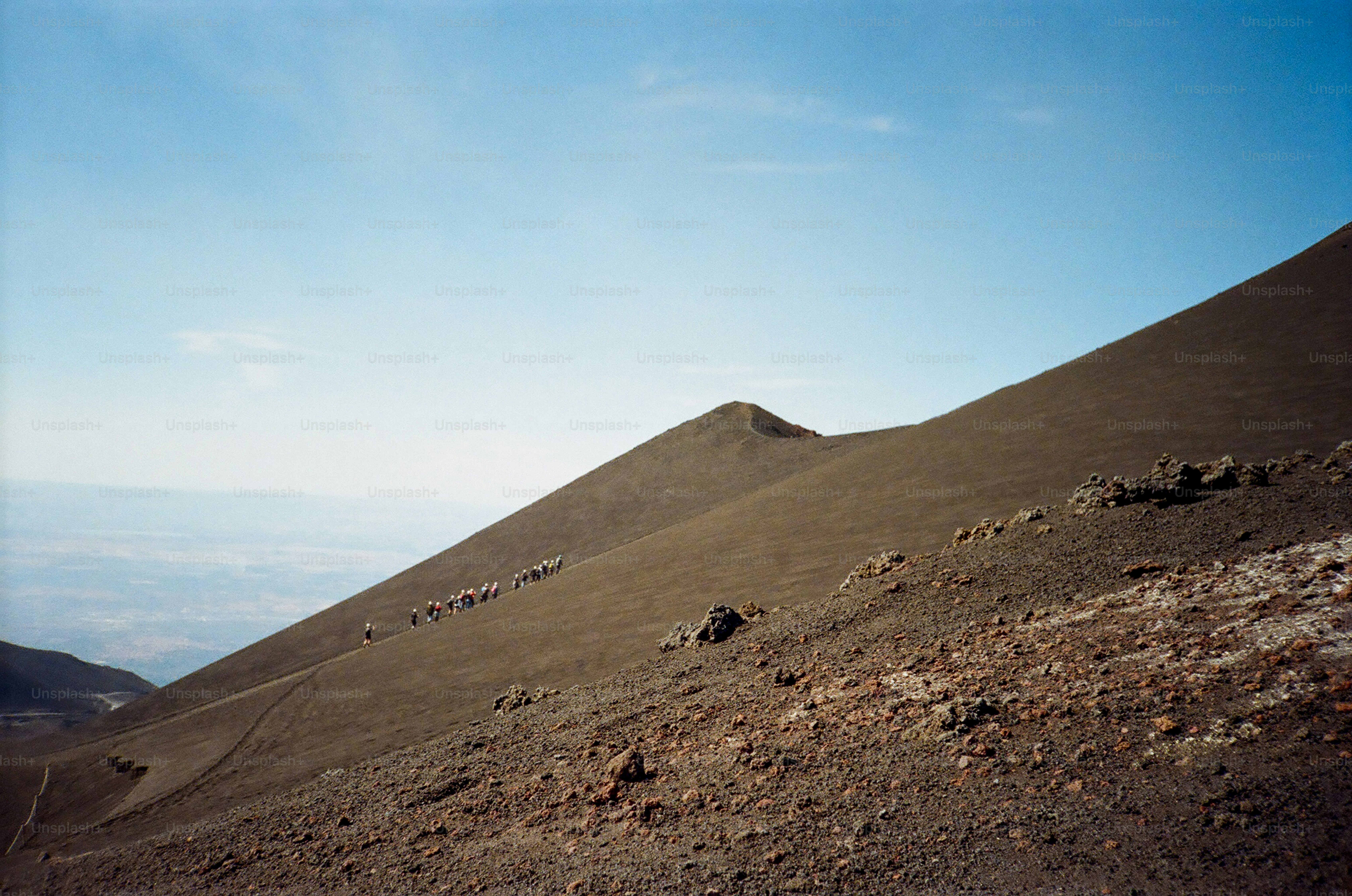 Volcanic slope with a clear blue sky above