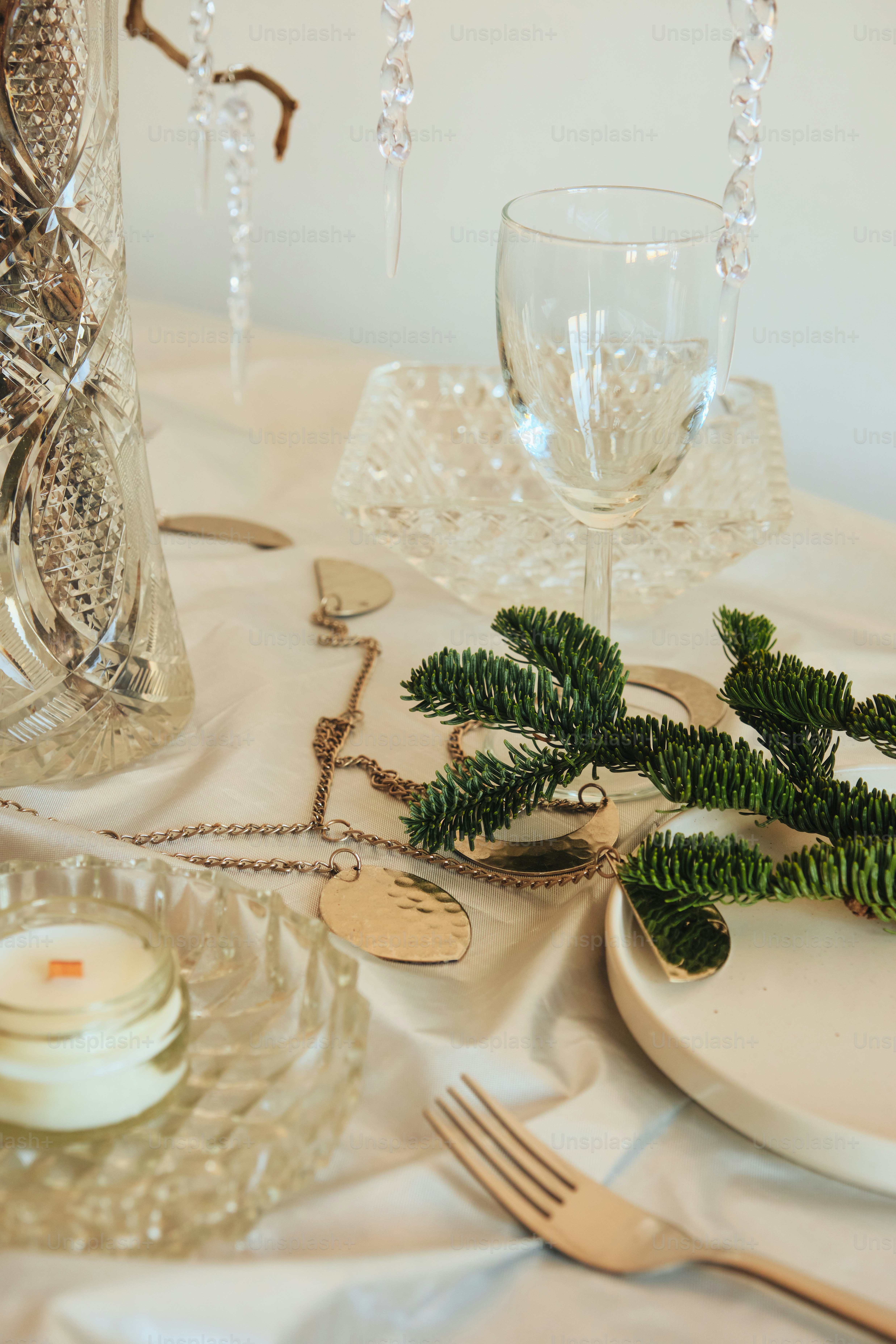 Elegant table setting with crystal and pine branch
