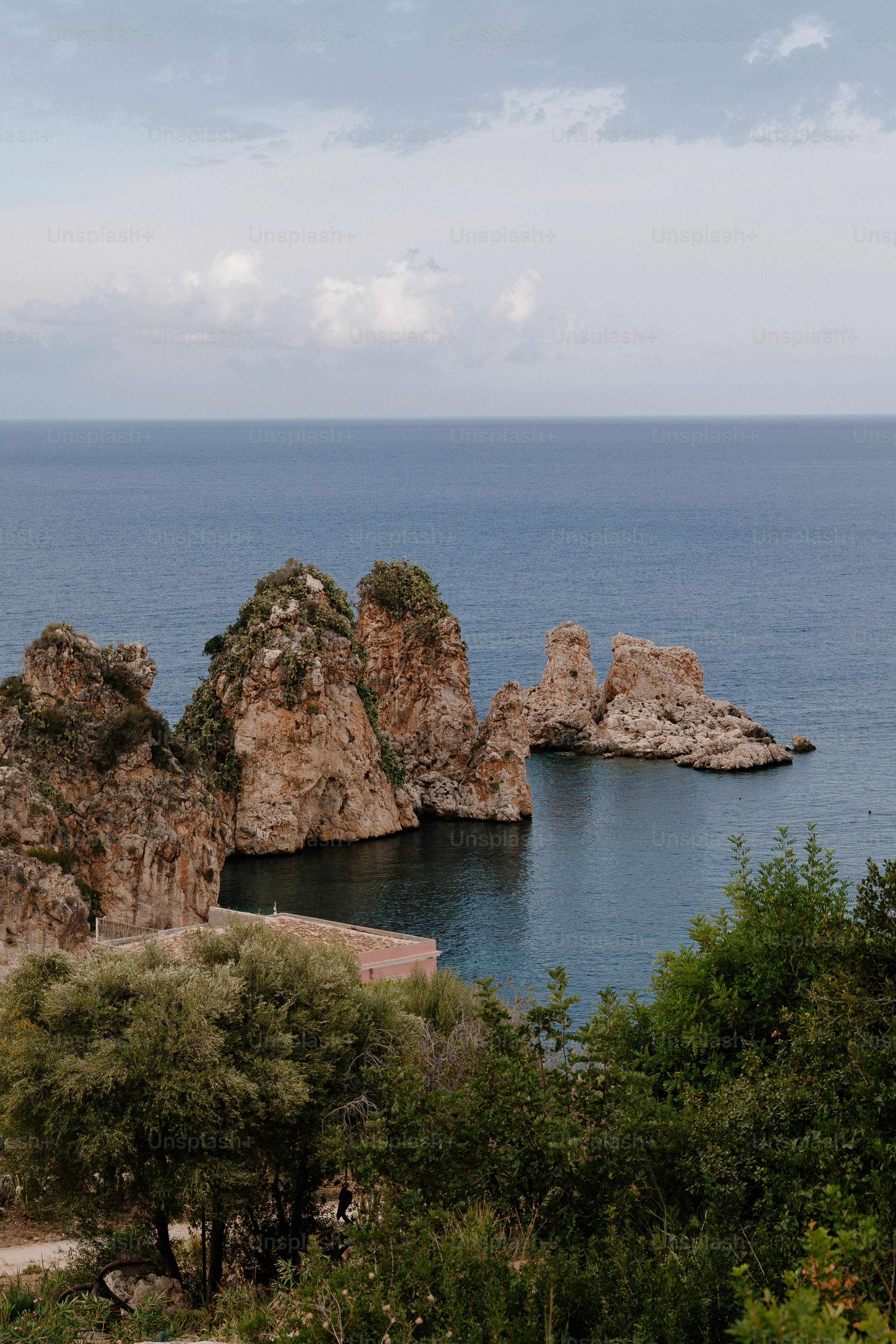 Rocky islands rise from the calm blue sea
