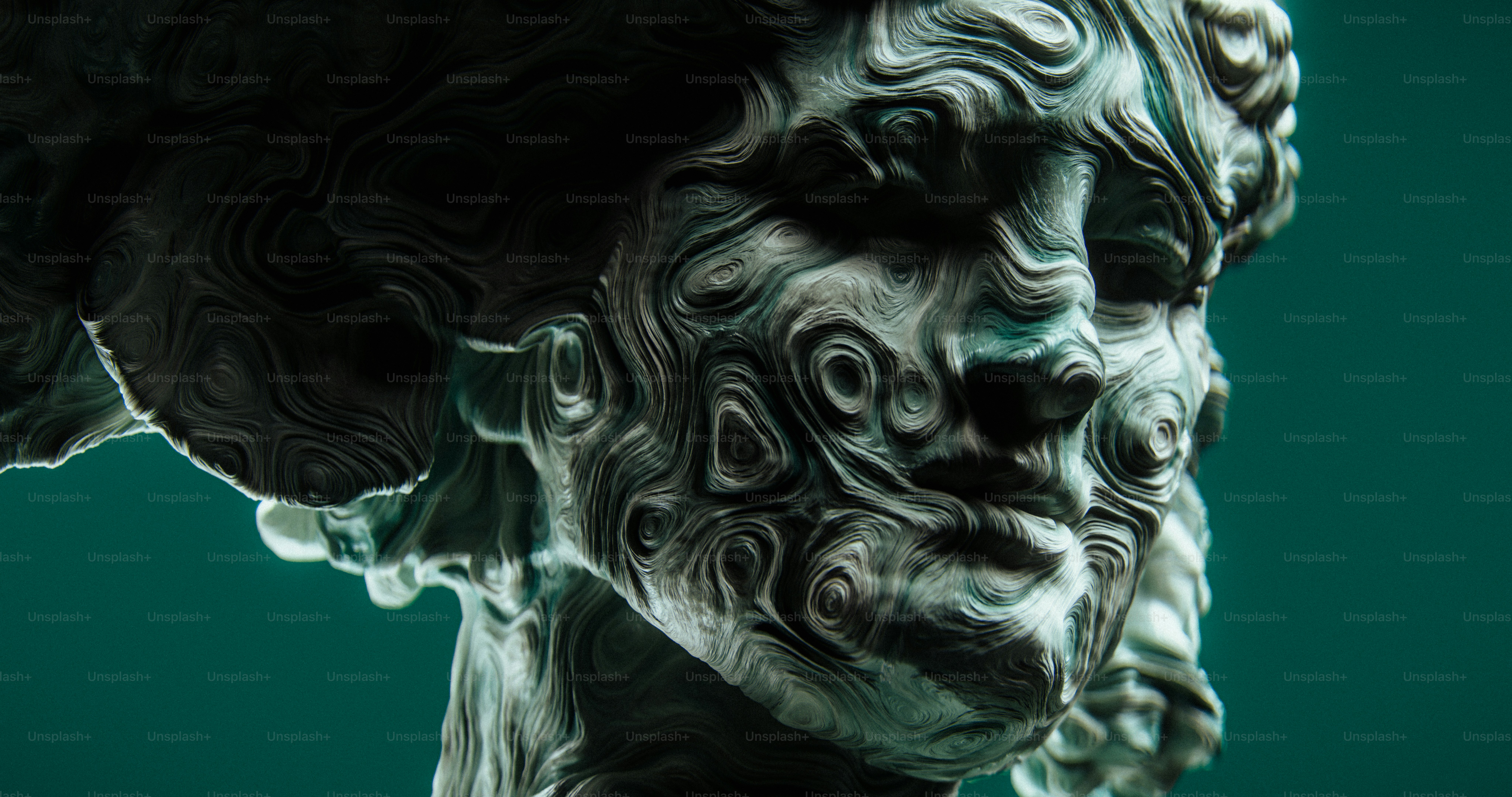 Abstract sculpture with swirling patterns on face