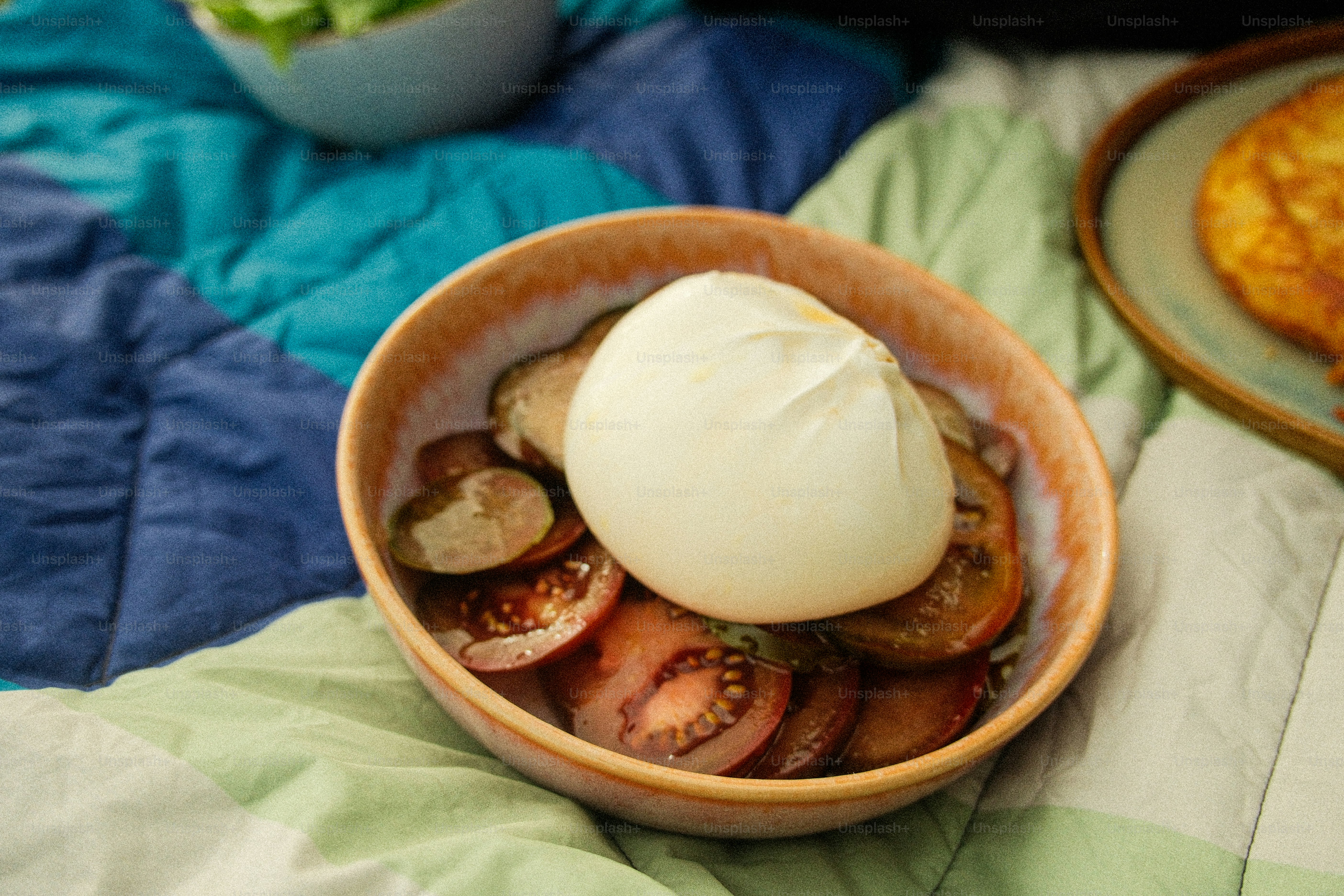 Burrata cheese served with sliced heirloom tomatoes.