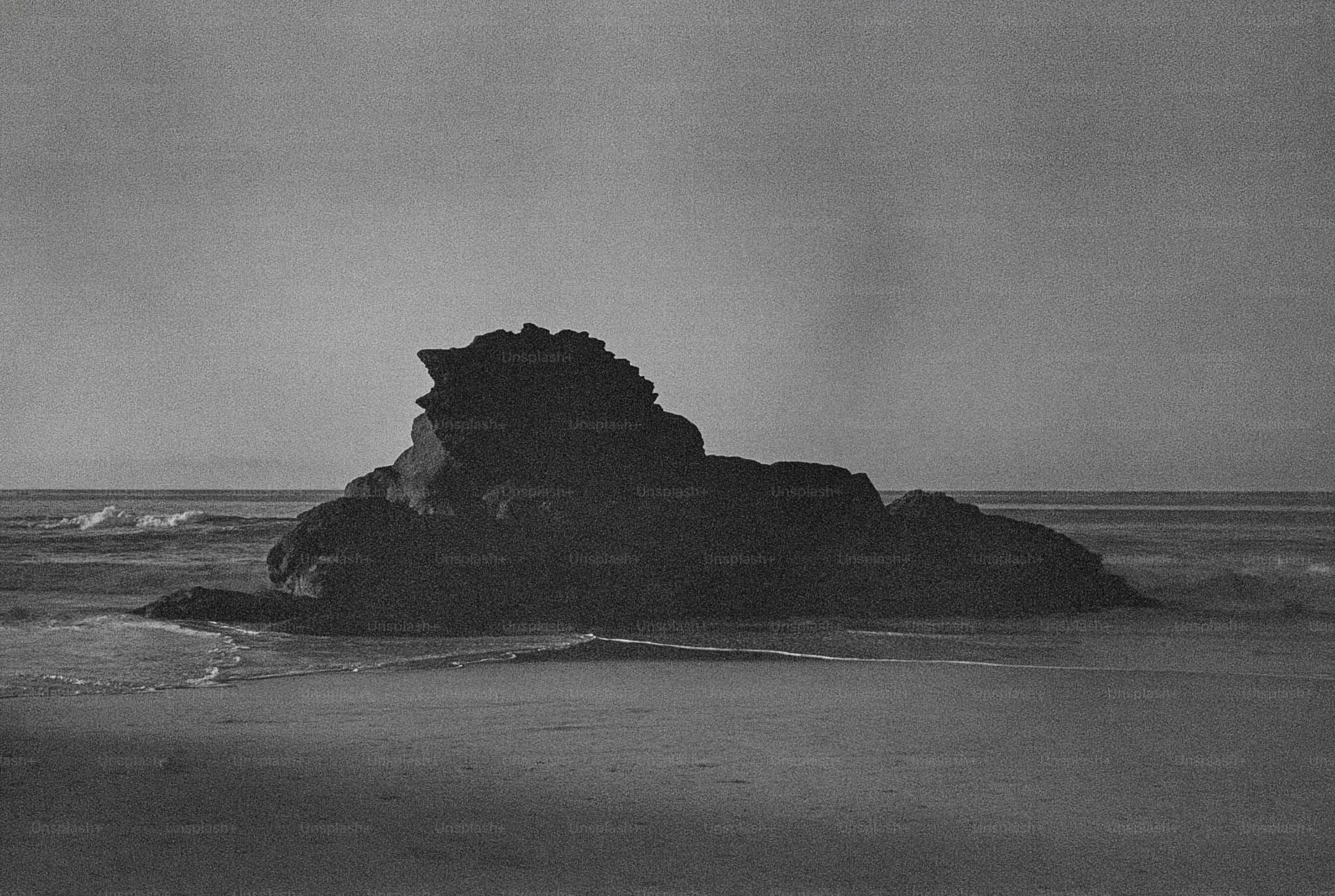 Large rock formation in the ocean waves
